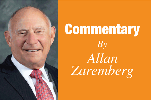 Portrait of a smiling man beside an orange panel reading 'Commentary By Allan Zaremberg.'