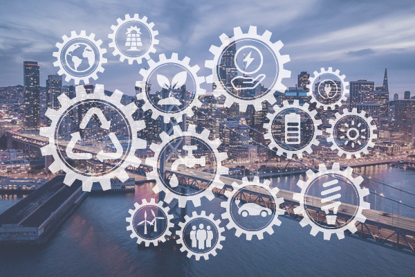 Interlocking gear graphics with environmental and energy symbols overlay a city skyline.