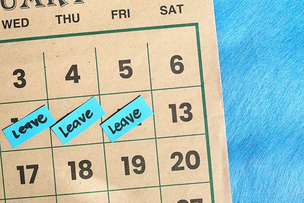 Three blue notes marked Leave cover consecutive dates on a calendar.
