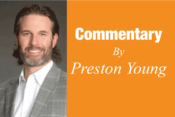 Portrait of a bearded man beside an orange panel reading 'Commentary By Preston Young.'