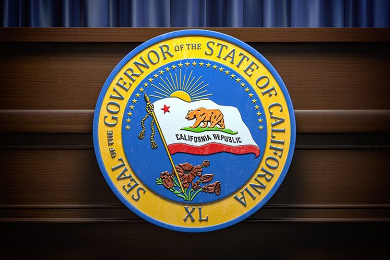 Seal of the Governor of the State of California mounted on a wooden panel.