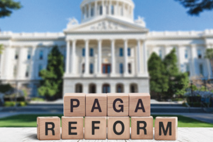 Wooden blocks spell PAGA REFORM in front of the California State Capitol.