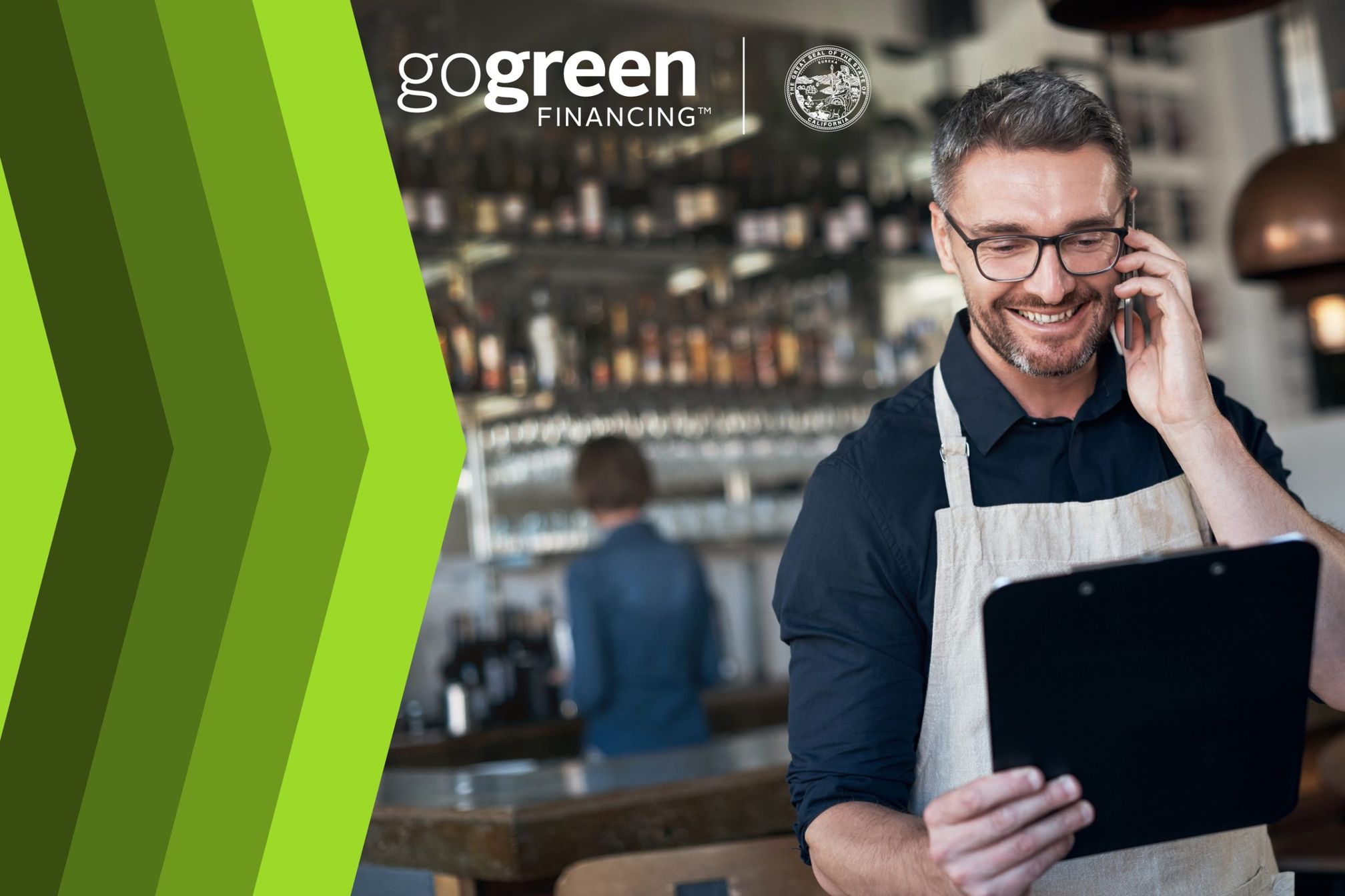 GoGreen Financing graphic with a smiling business owner holding a tablet and talking on a phone.