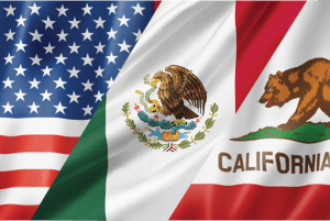 U.S., Mexican and California flags shown on rippling fabric.