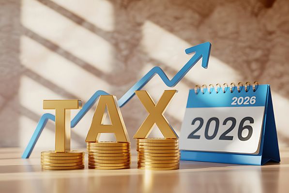 Gold TAX letters stand on coin stacks beside a 2026 calendar and rising blue arrow.