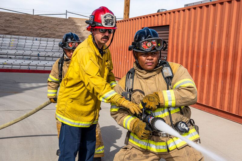 Mt. San Antonio College fire academy instructor demonstrates proper firehose operations (February 8, 2020). Photo courtesy California Community Colleges.