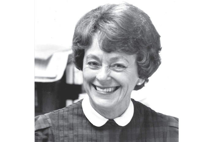 Black-and-white portrait of Esther Rushford Greene smiling in a dark dress with a white collar.