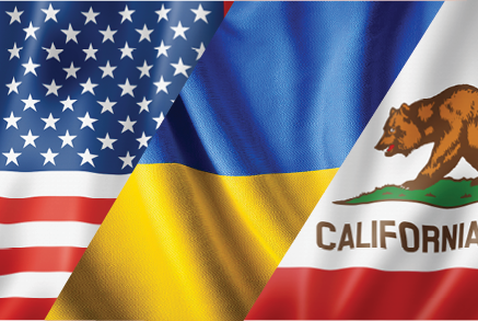 Overlapping United States, Ukraine and California flags.