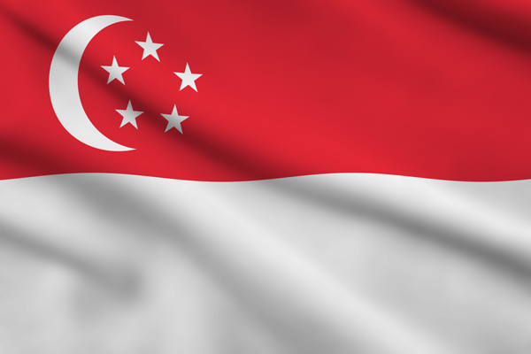 Singapore flag with a white crescent and five stars on rippling red and white fabric.