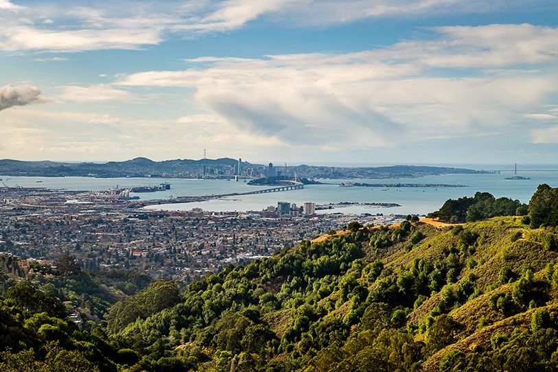 Panoramic view from green hills across Berkeley and San Francisco Bay.