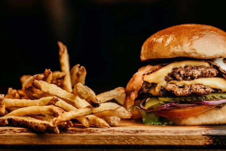 A big hamburger with fries