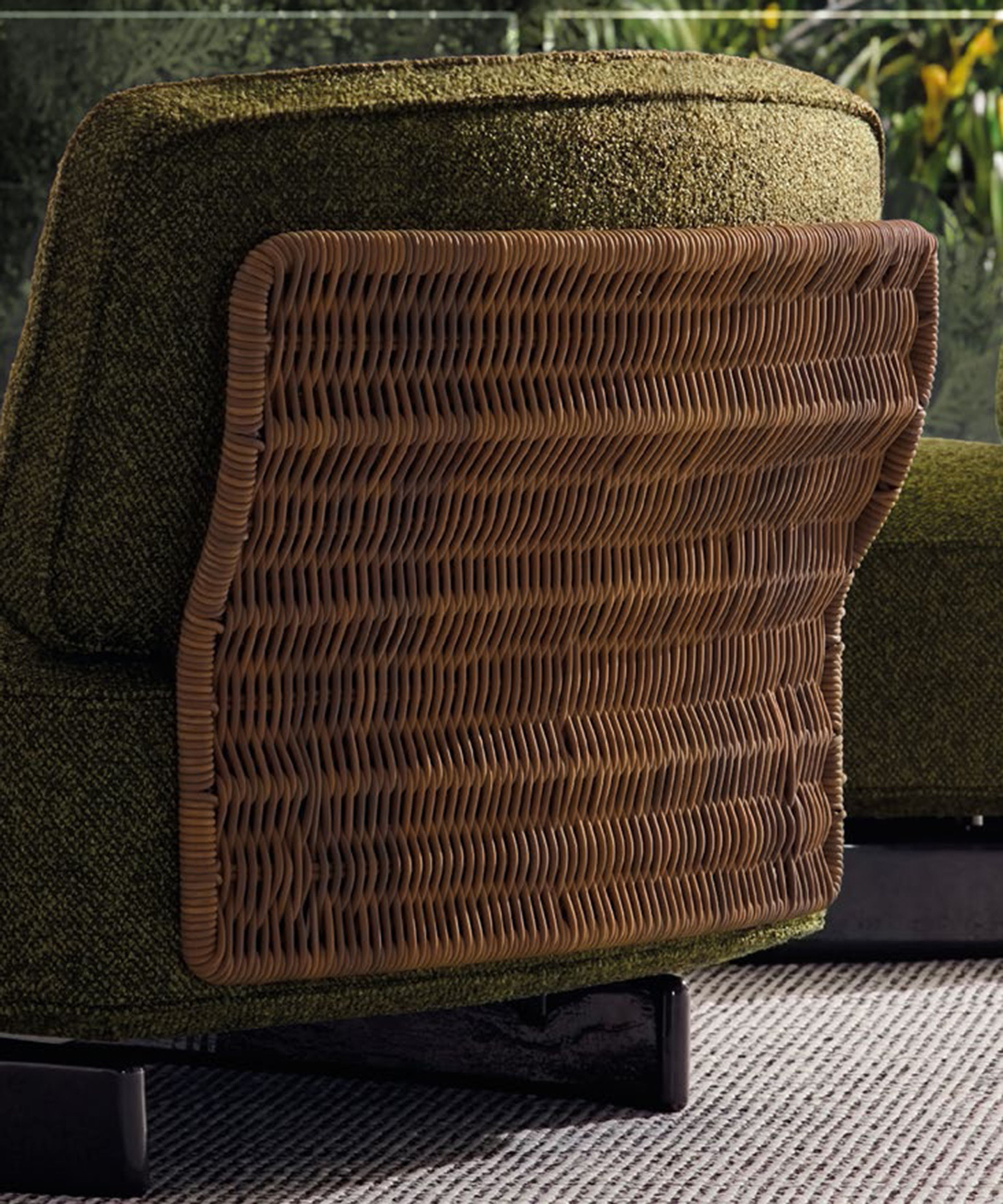 The Saki Cord Outdoor sofa combines sinuous panels with a woven cord structure.
