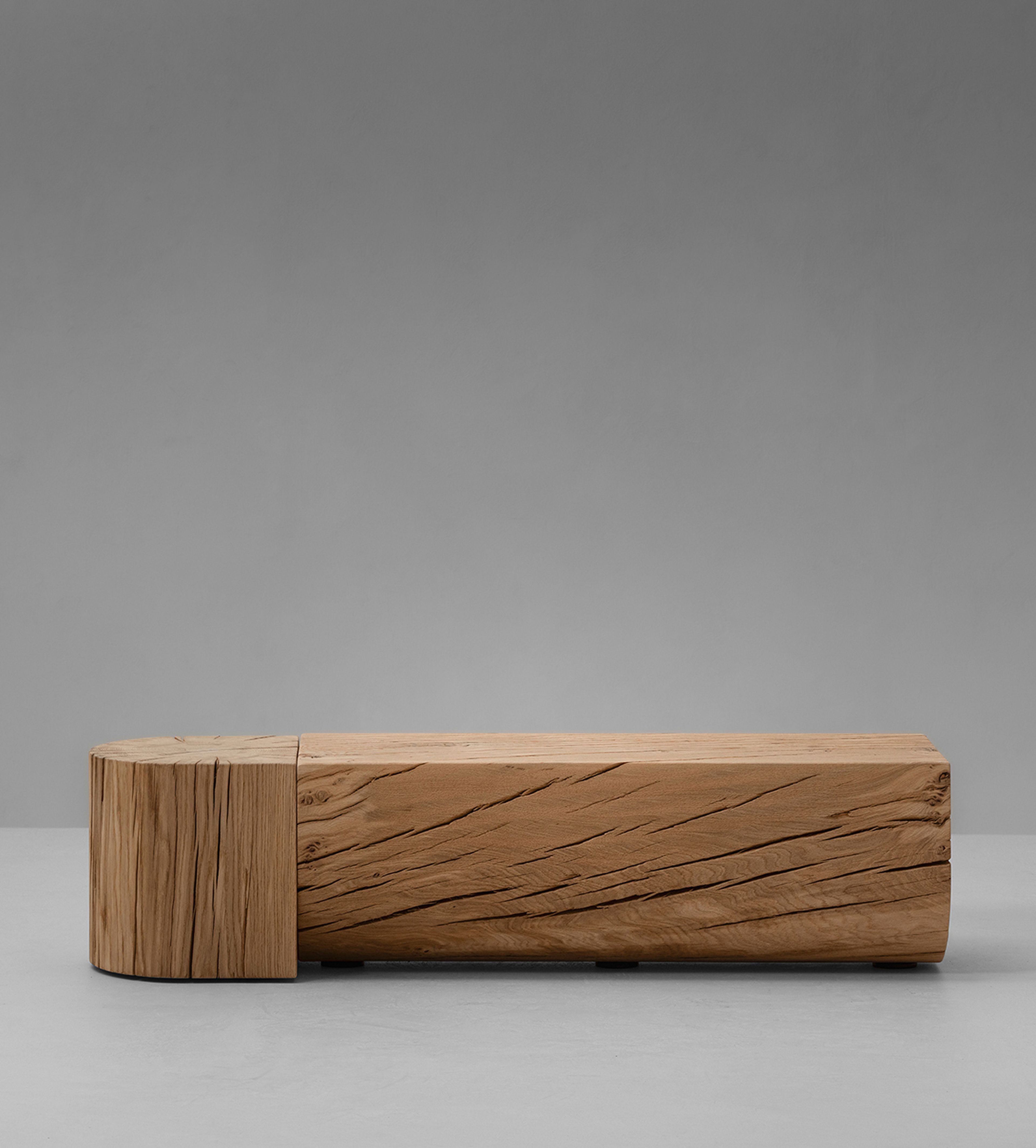 The Adjacencies Bench features a solid oak surface with a clear rectangular form.