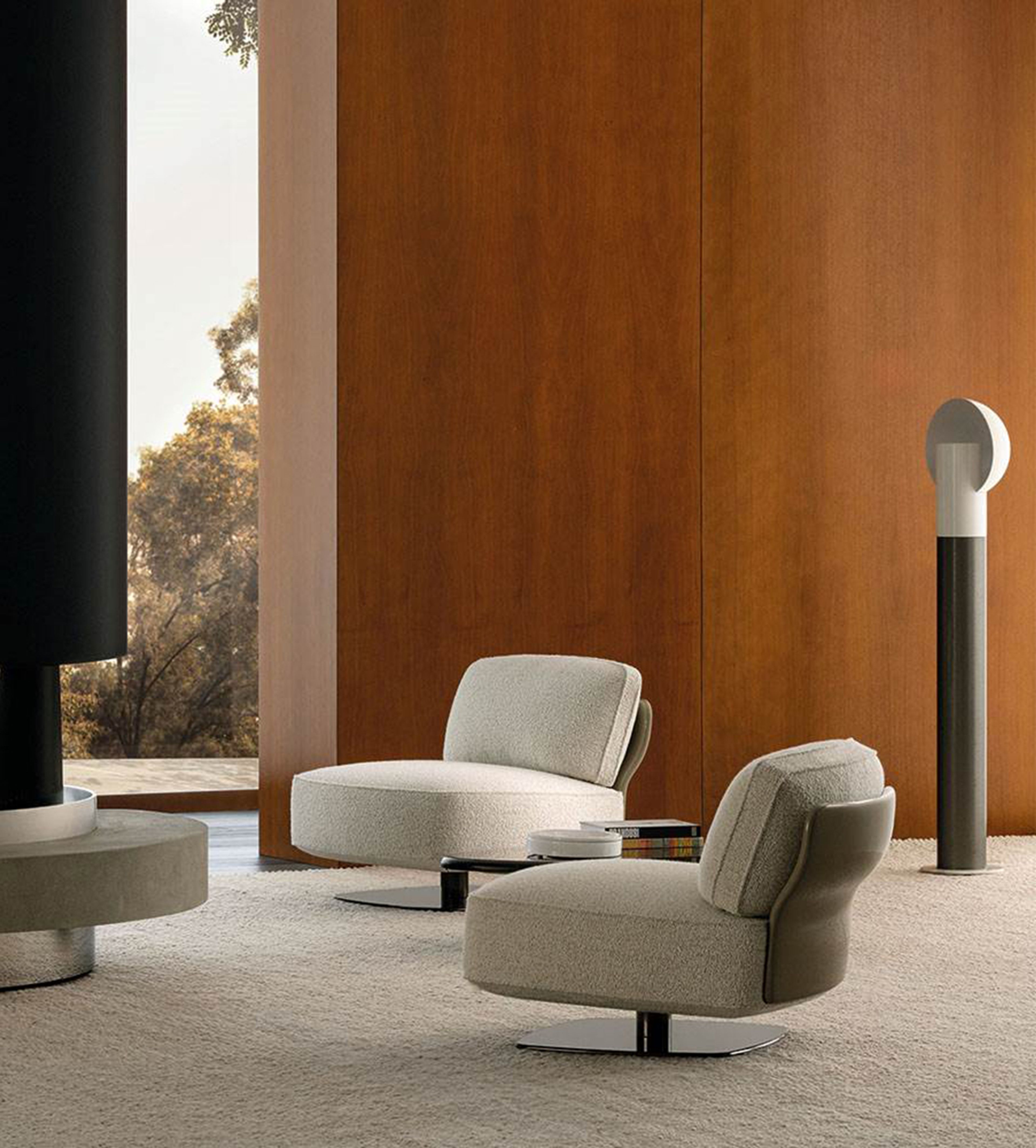 A sculptural armchair with enveloping organic forms by Minotti.