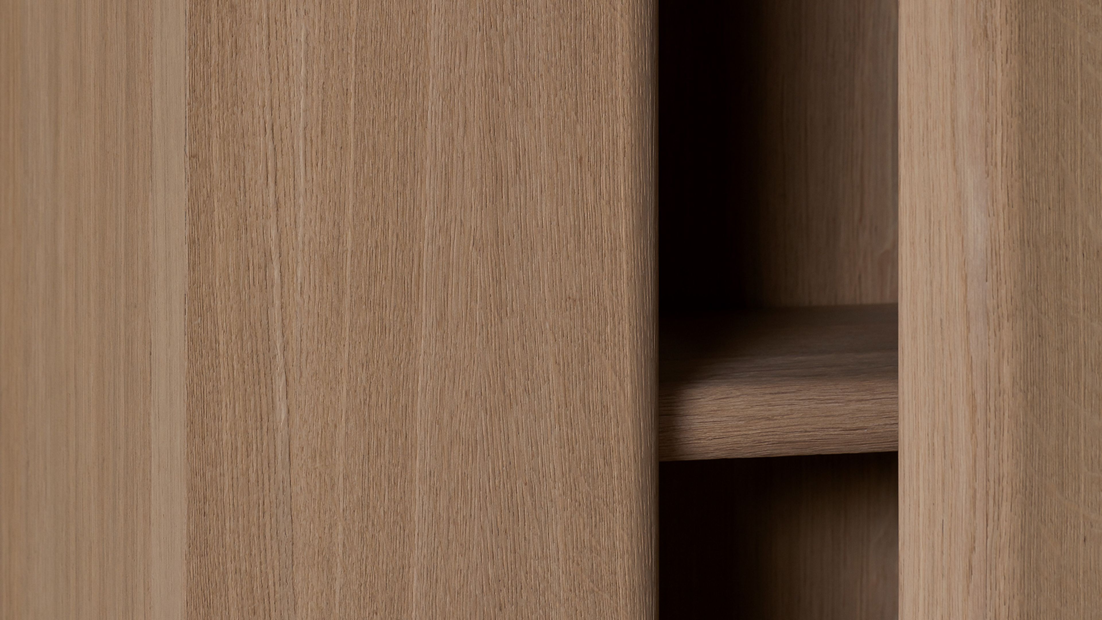A tall, sleek storage cabinet by Van Rossum.