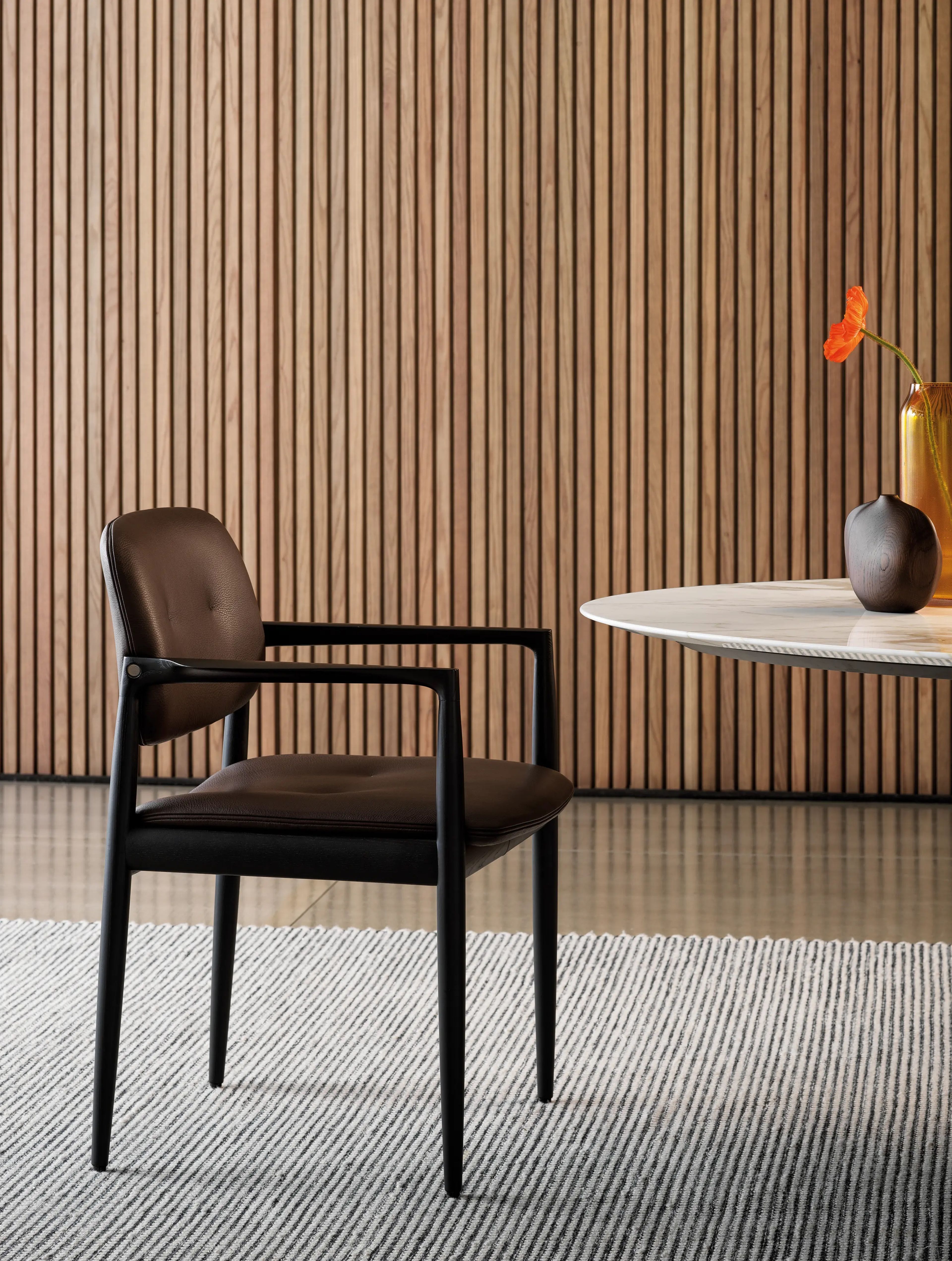 A light and elegant dining little armchair by Minotti.