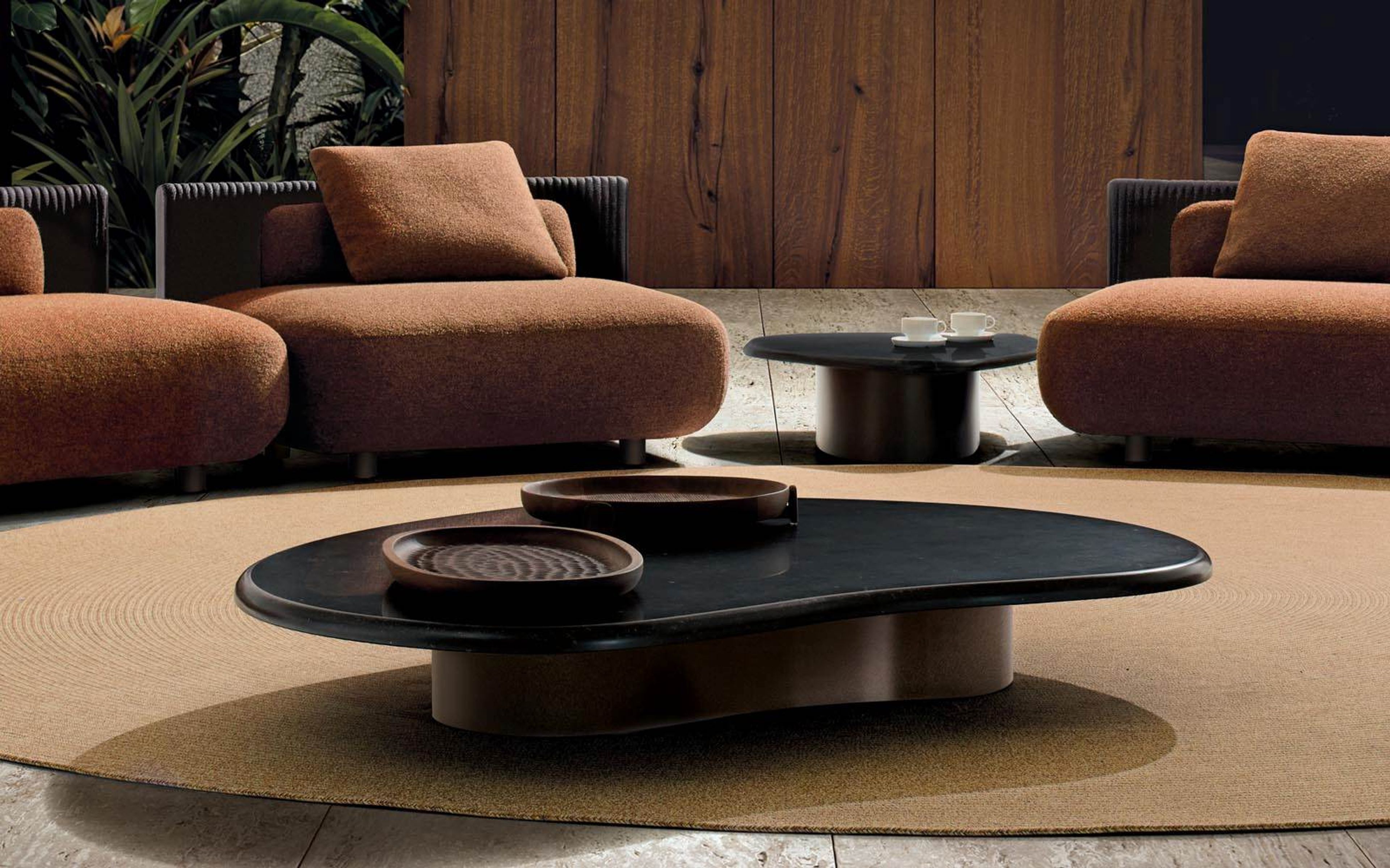 Minotti`s Bézier Outdoor table defined by a fluid, continuous form.