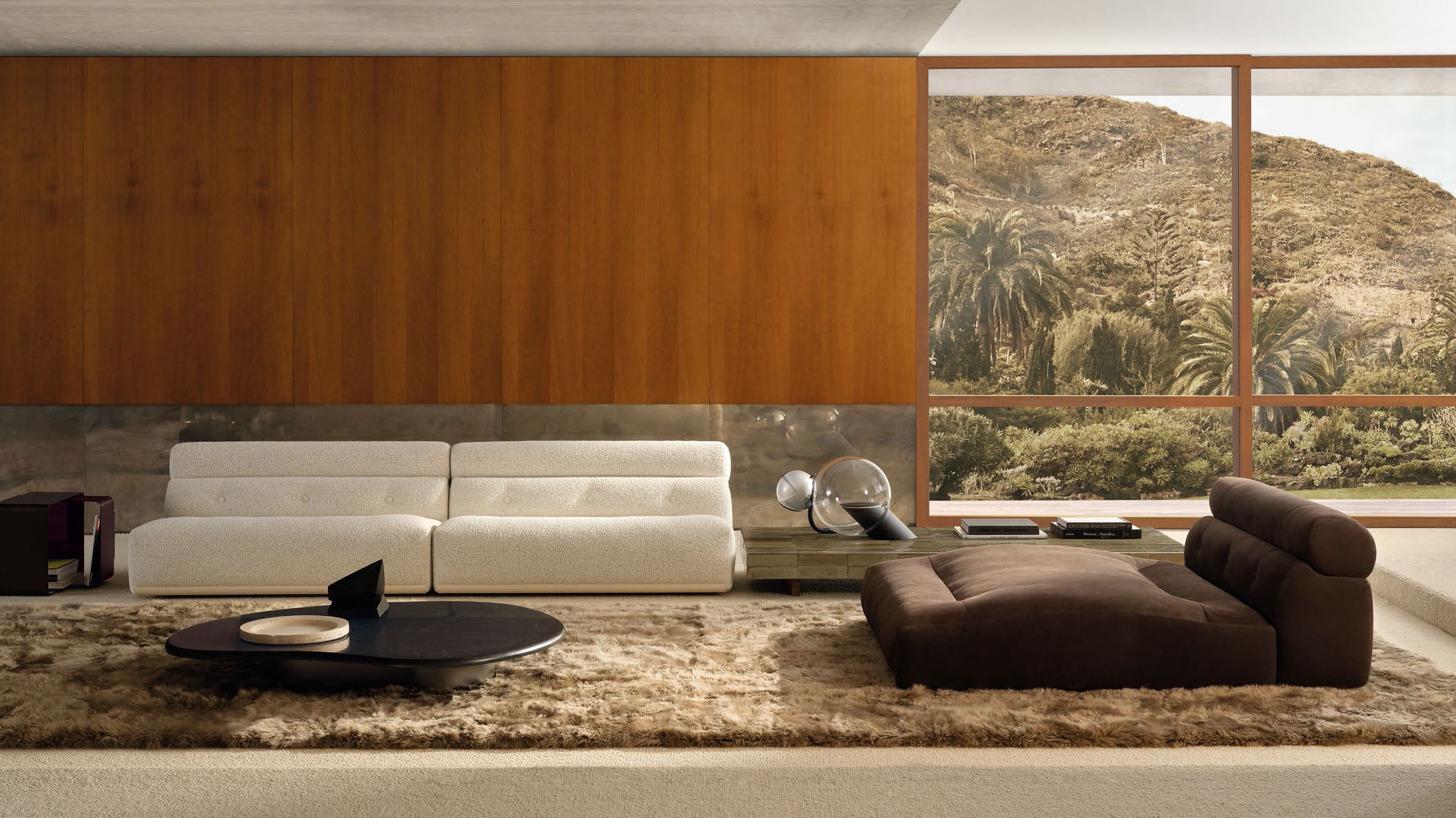 Un système d'assise aux volumes arrondis superposés, signé Minotti.