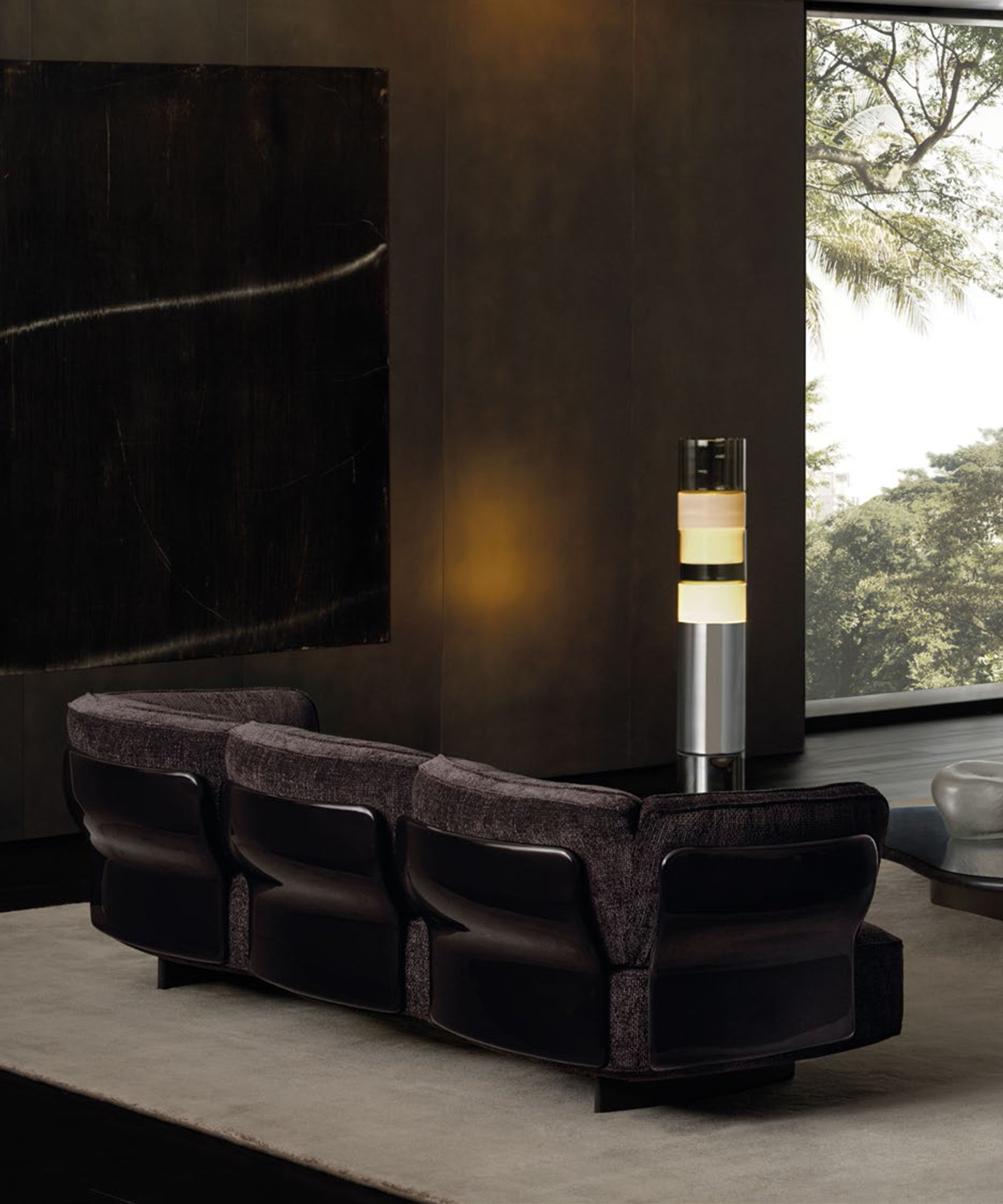 A blooming sofa by Minotti with sinuous support panels and organic forms.