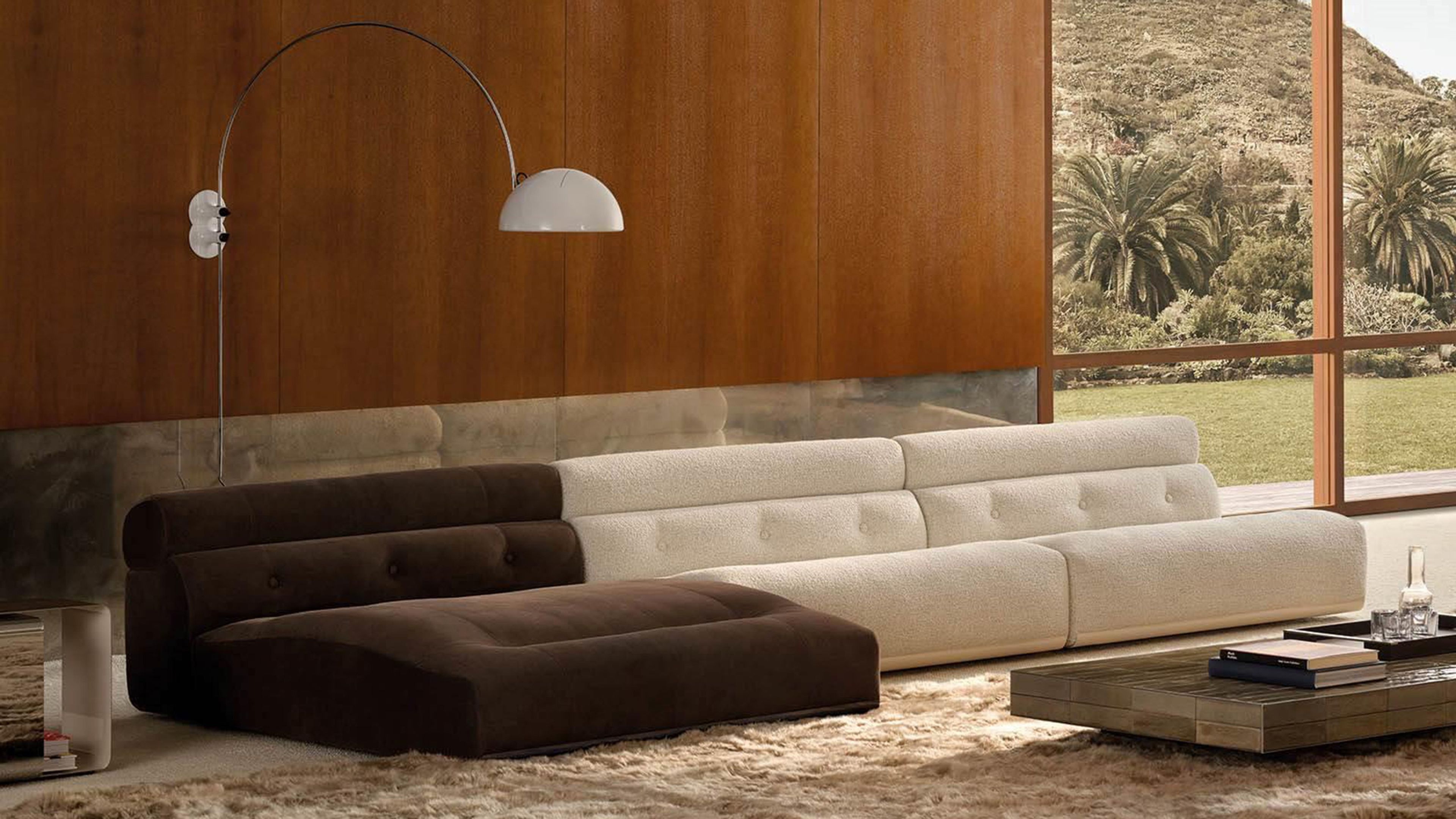 Un système d'assise aux volumes arrondis superposés, signé Minotti.
