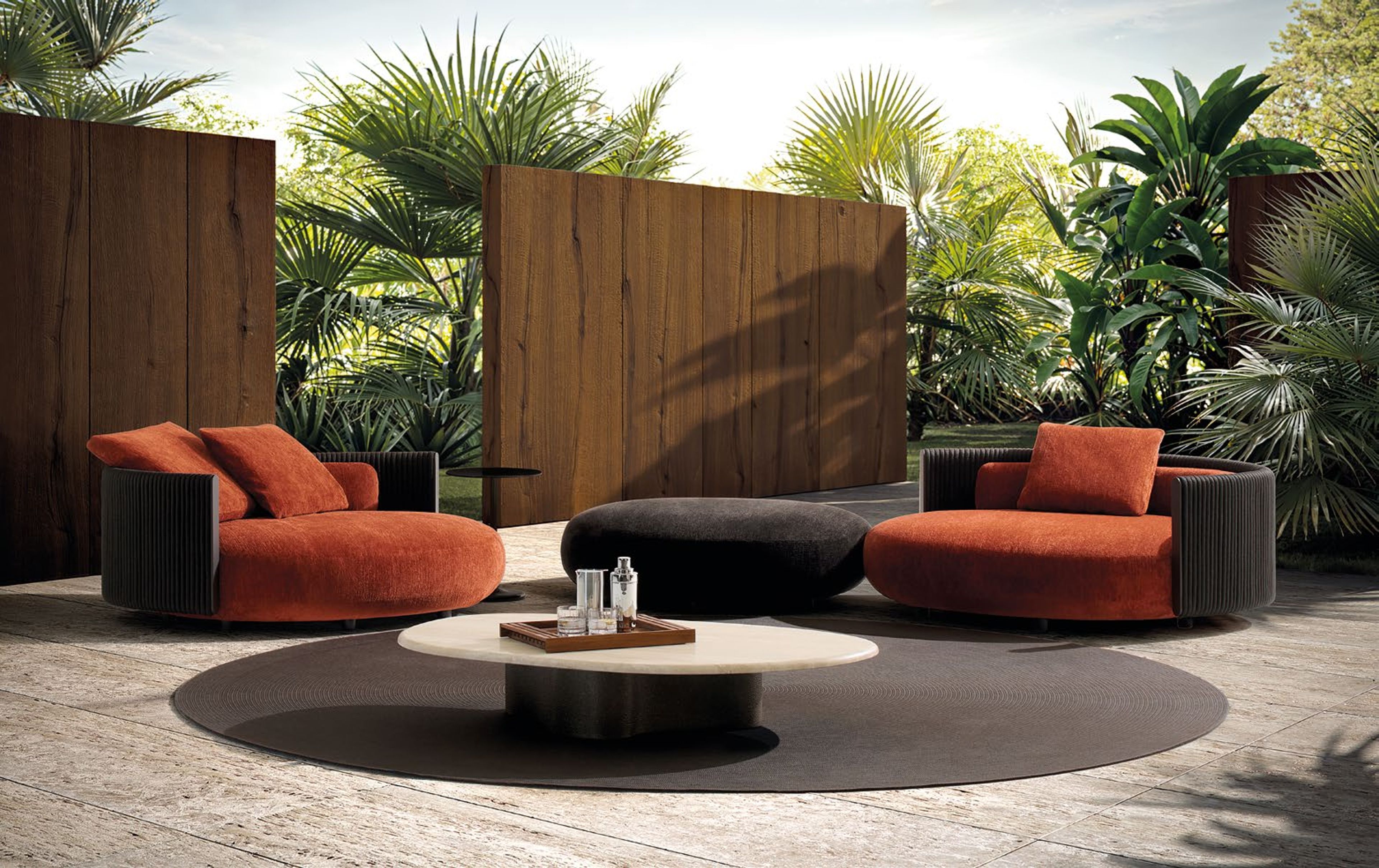 Minotti`s Bézier Outdoor table defined by a fluid, continuous form.