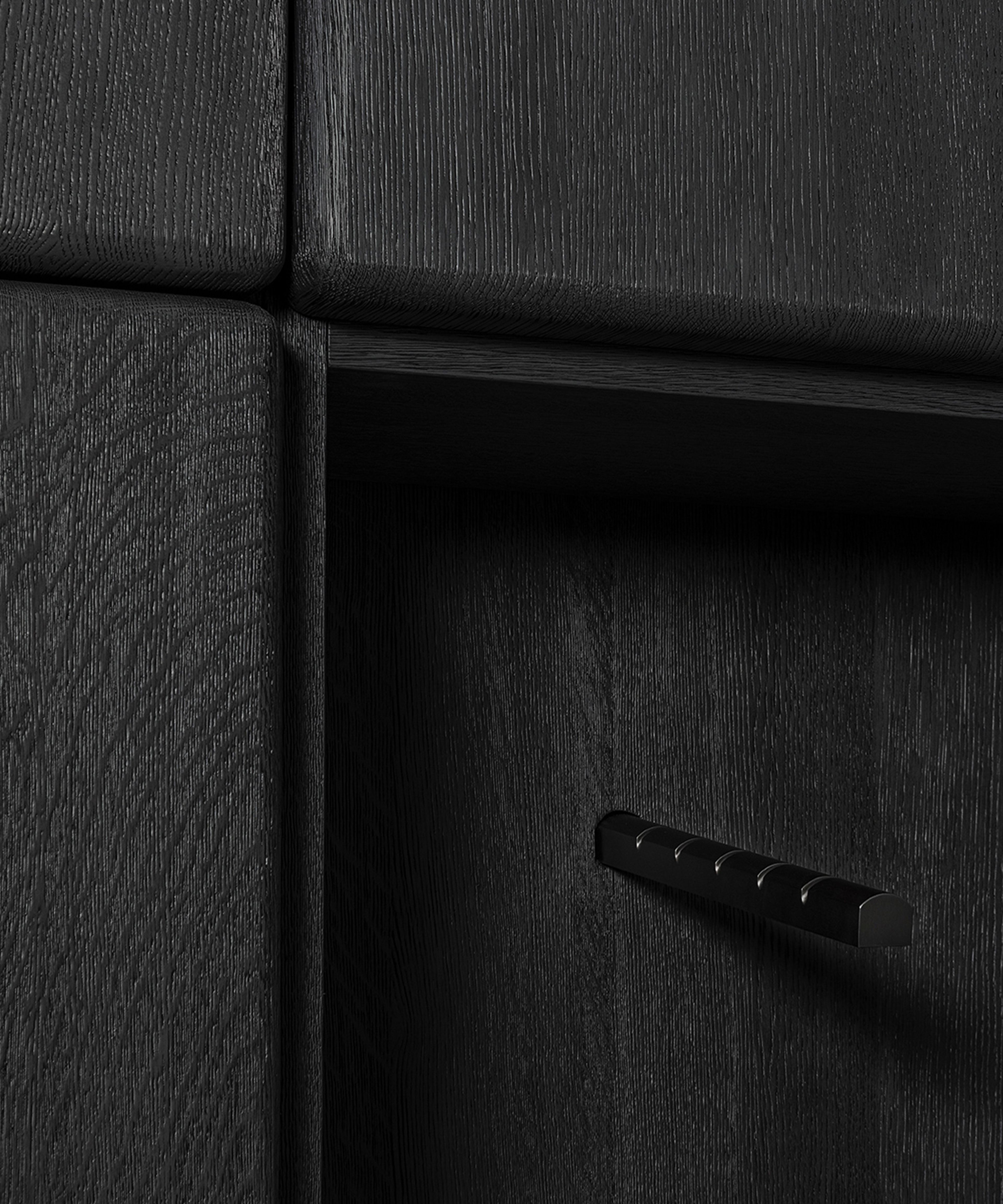 A wardrobe cabinet by Van Rossum divided into two asymmetrical parts.