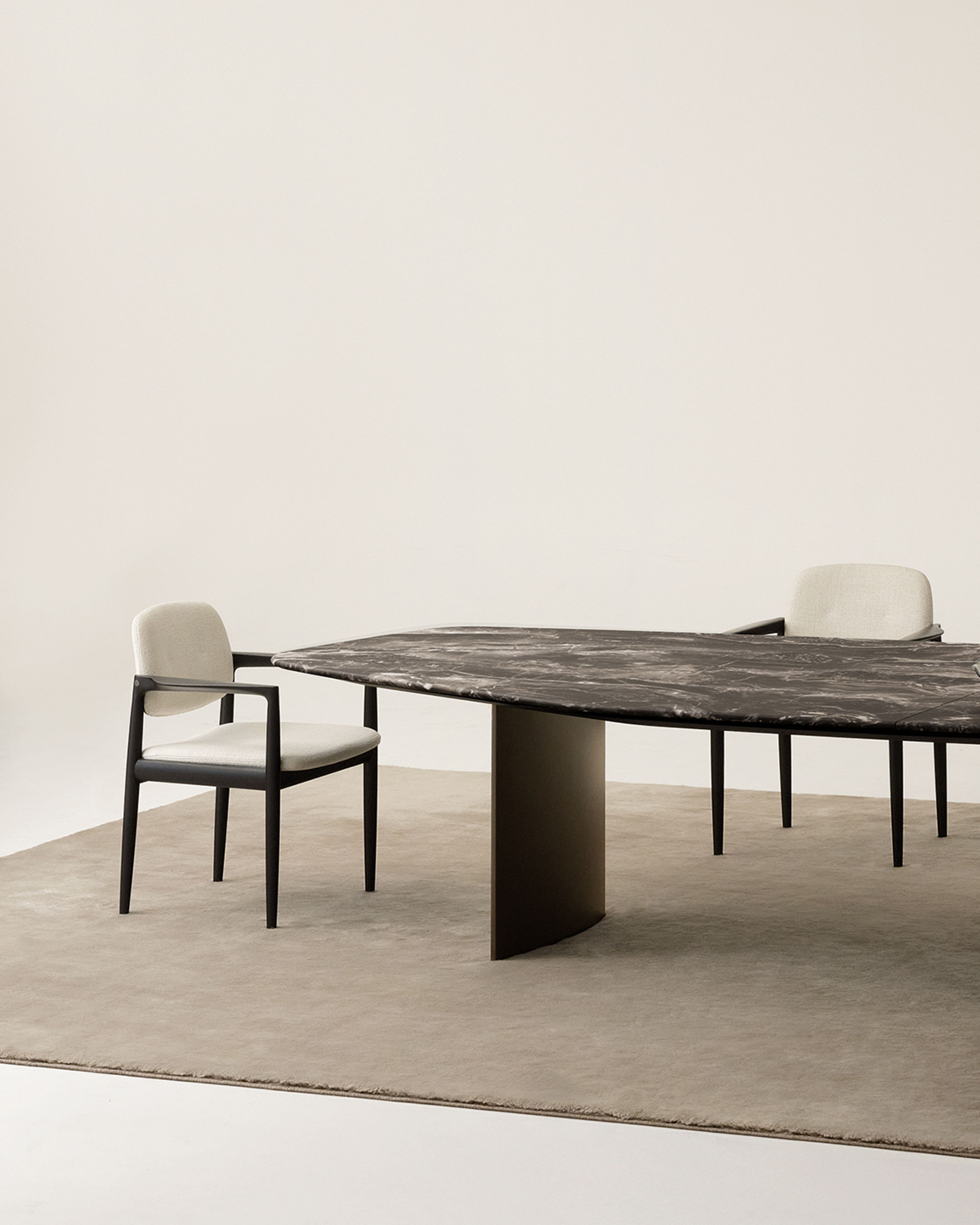 Dining table of a dynamic polygonal form by Minotti.