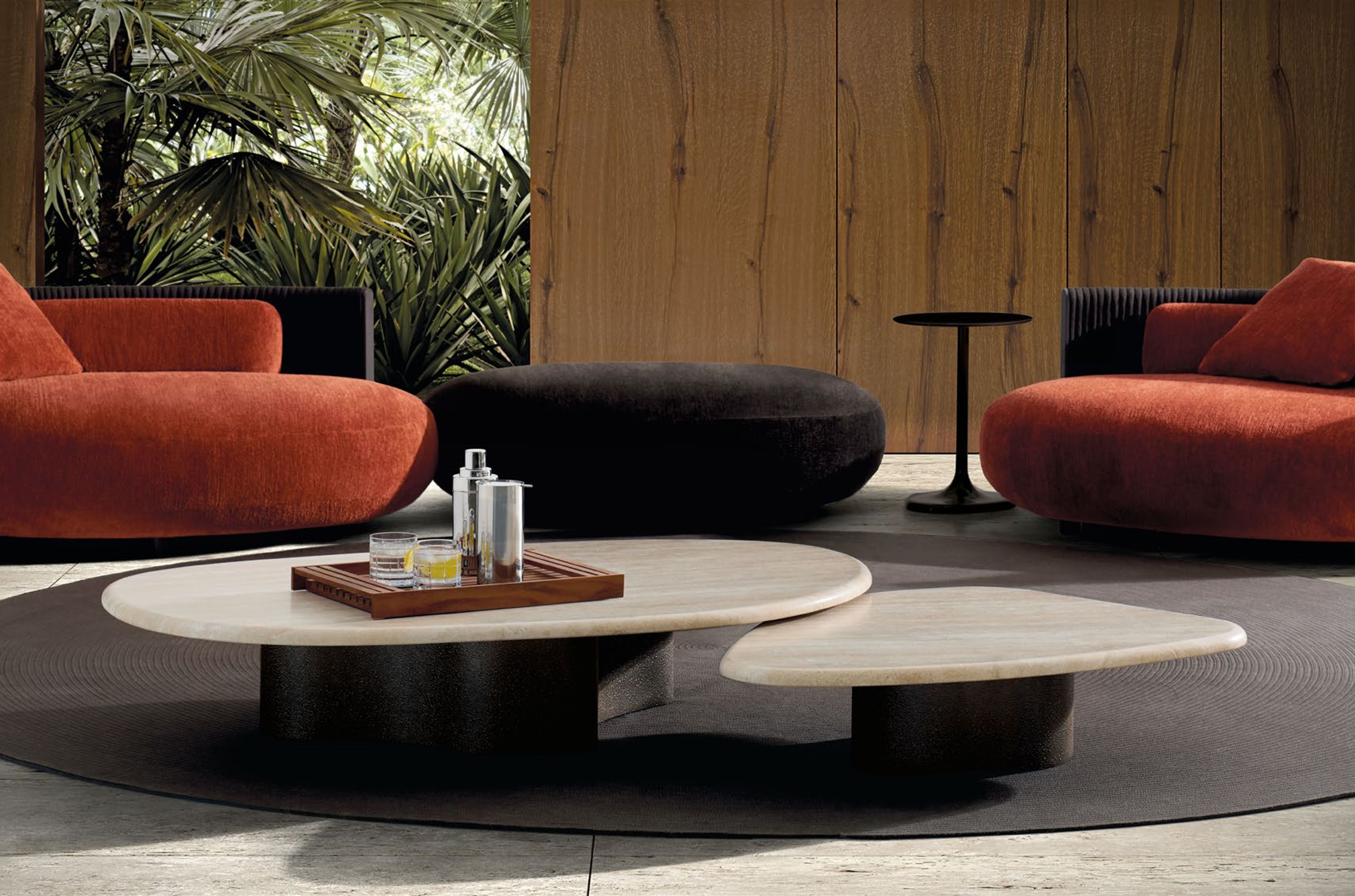 Minotti`s Bézier Outdoor table defined by a fluid, continuous form.
