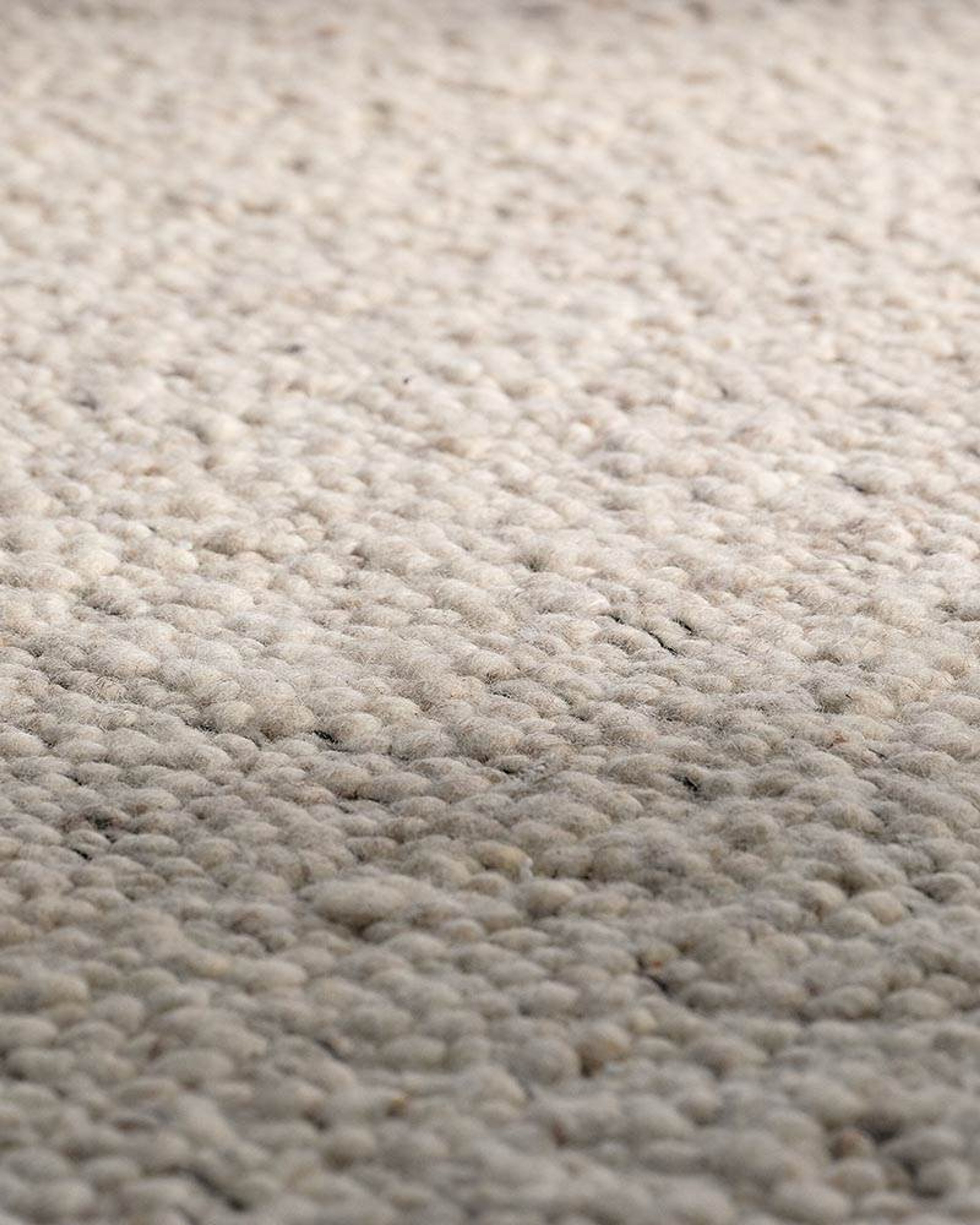 The Zealand rug by Minotti is hand-woven from New Zealand wool.