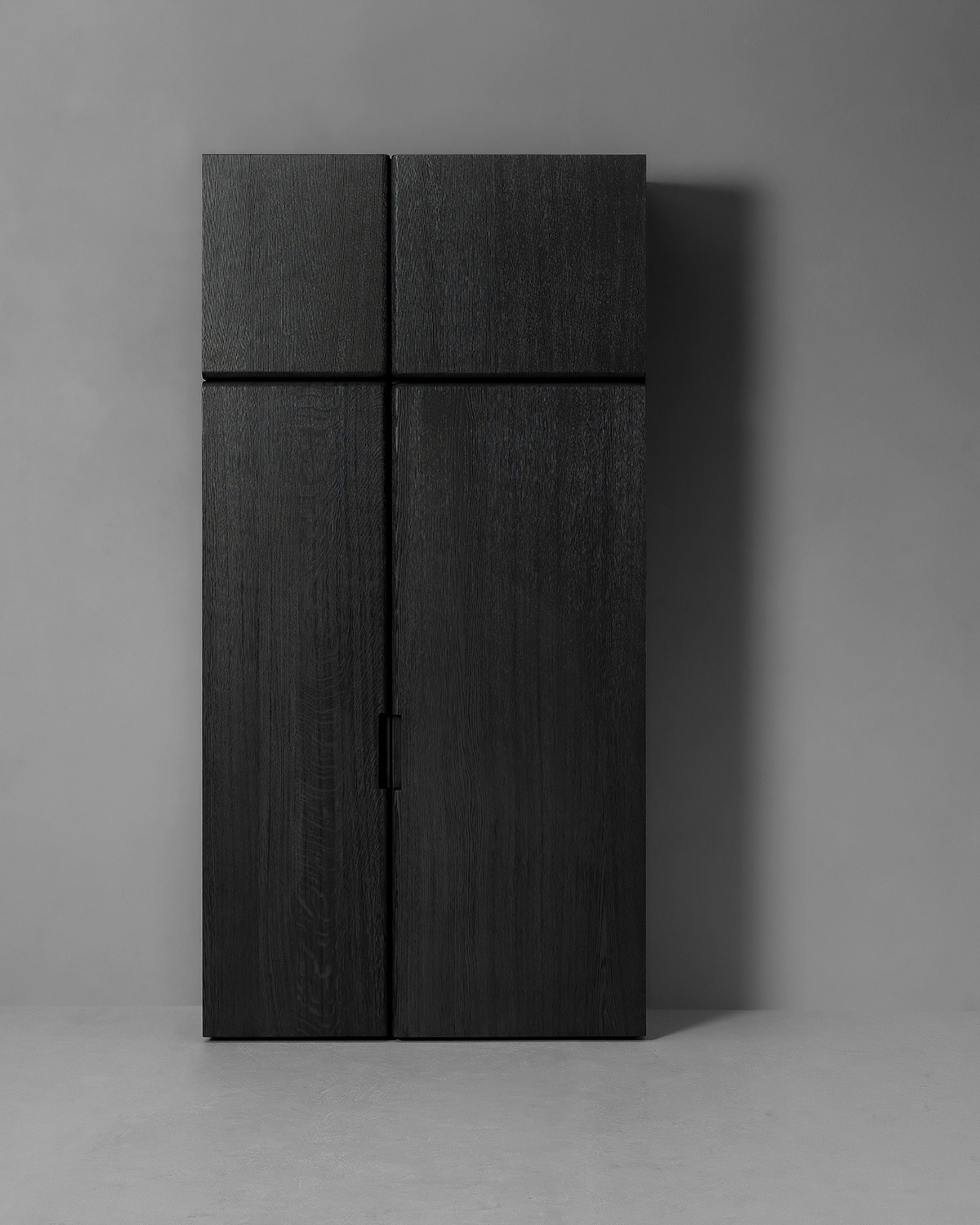 Une armoire de Van Rossum divisée en deux parties asymétriques.