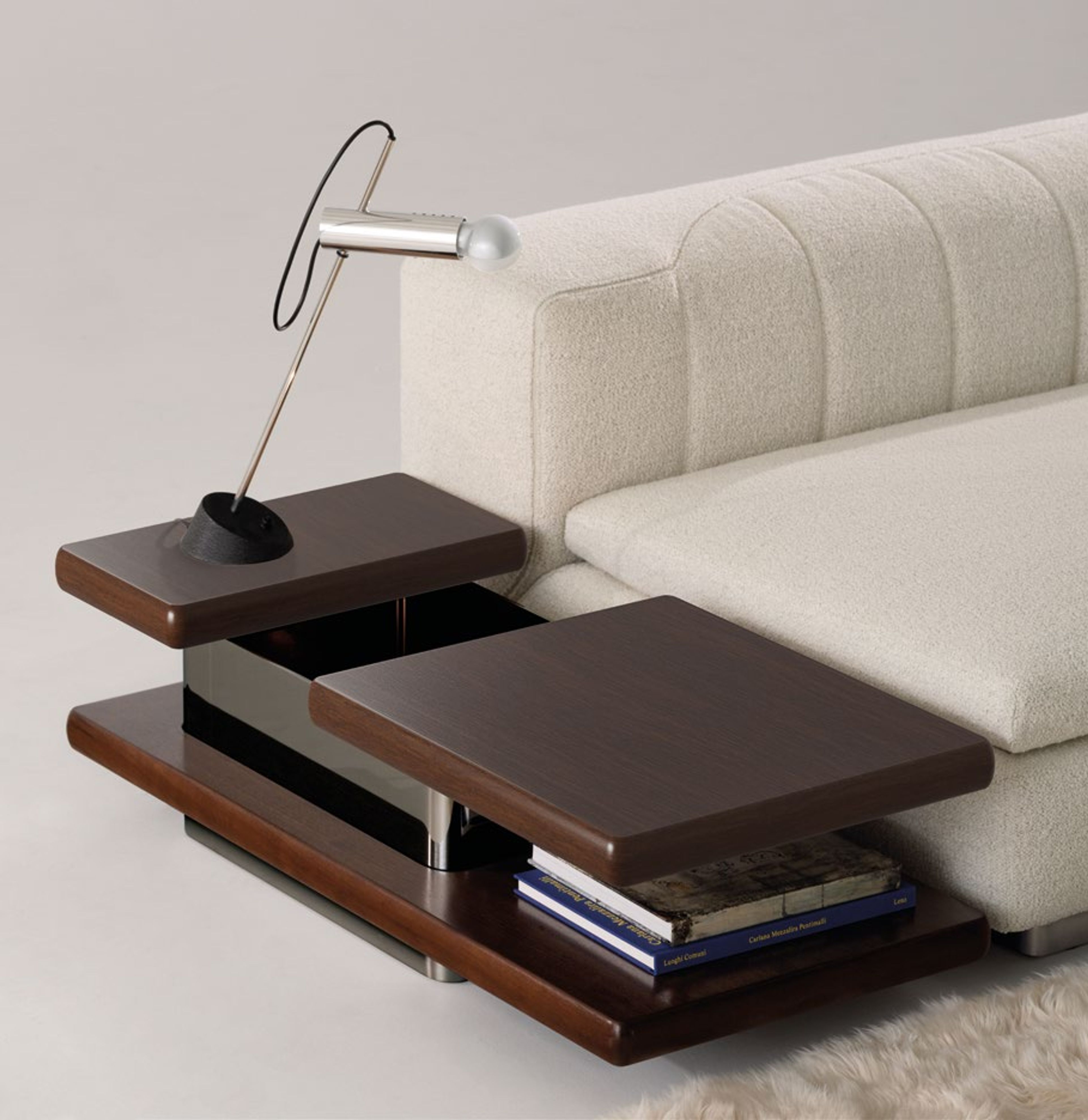 Minotti Coffee table defined by sharp geometric volumes.