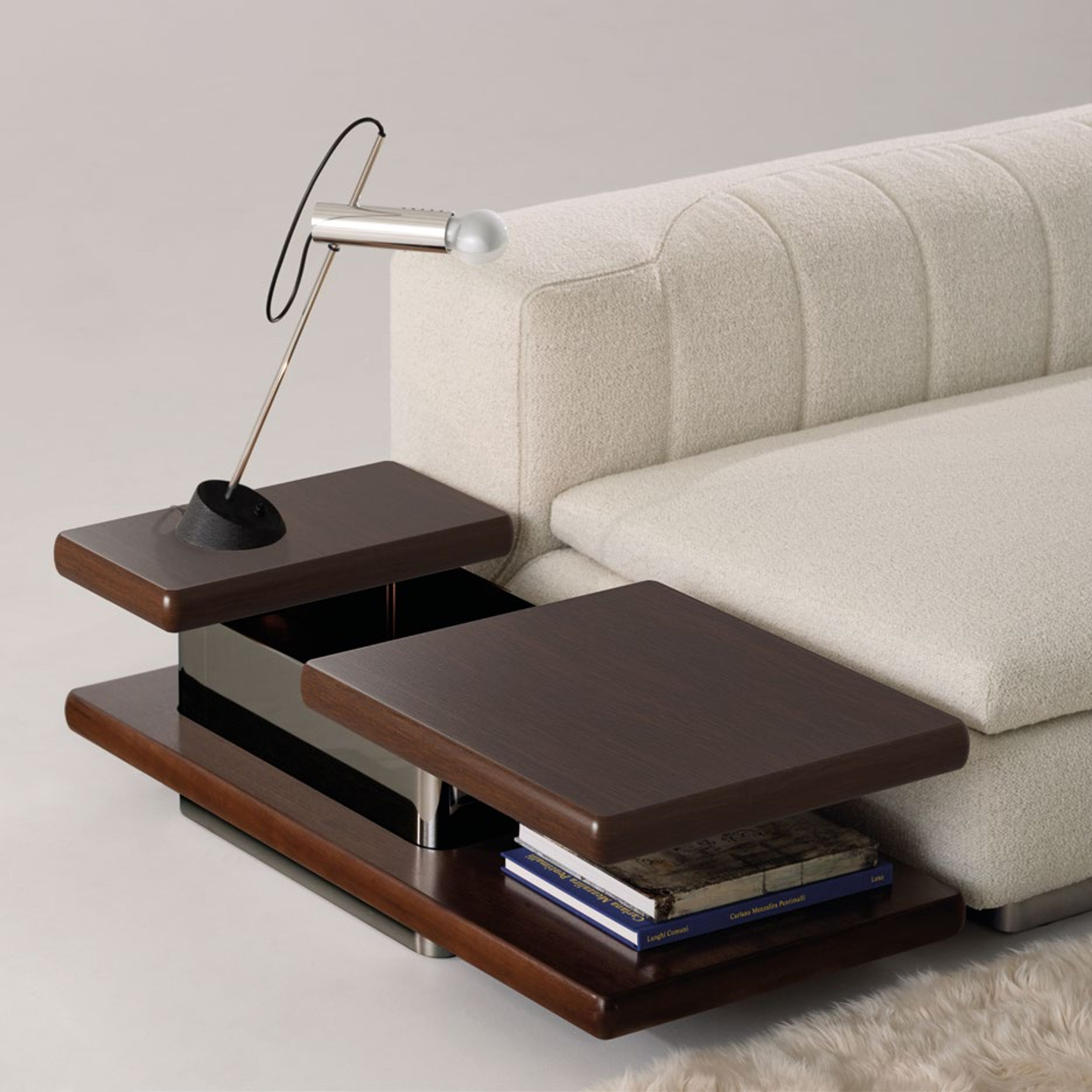 Minotti Coffee table defined by sharp geometric volumes.