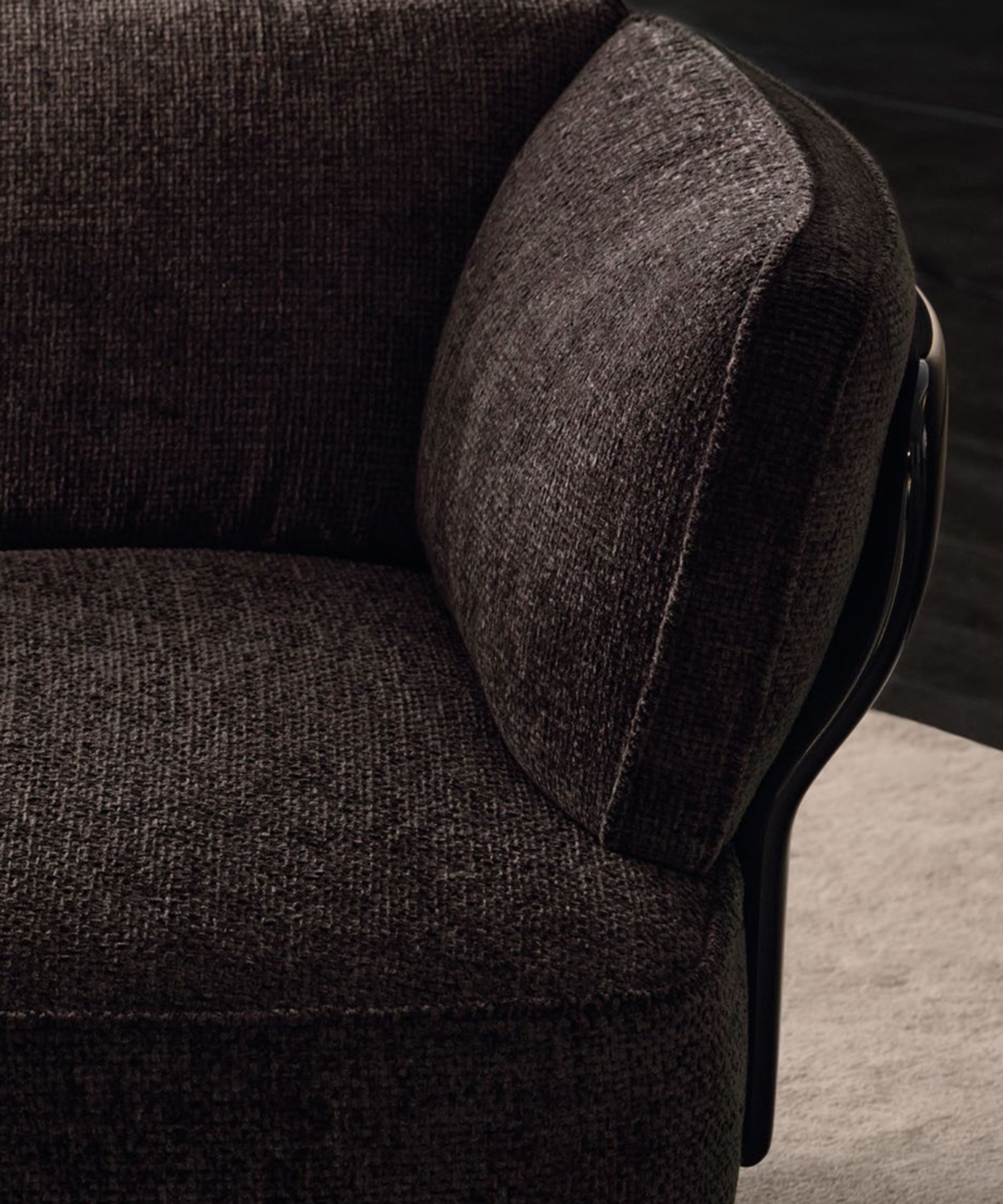 A blooming sofa by Minotti with sinuous support panels and organic forms.