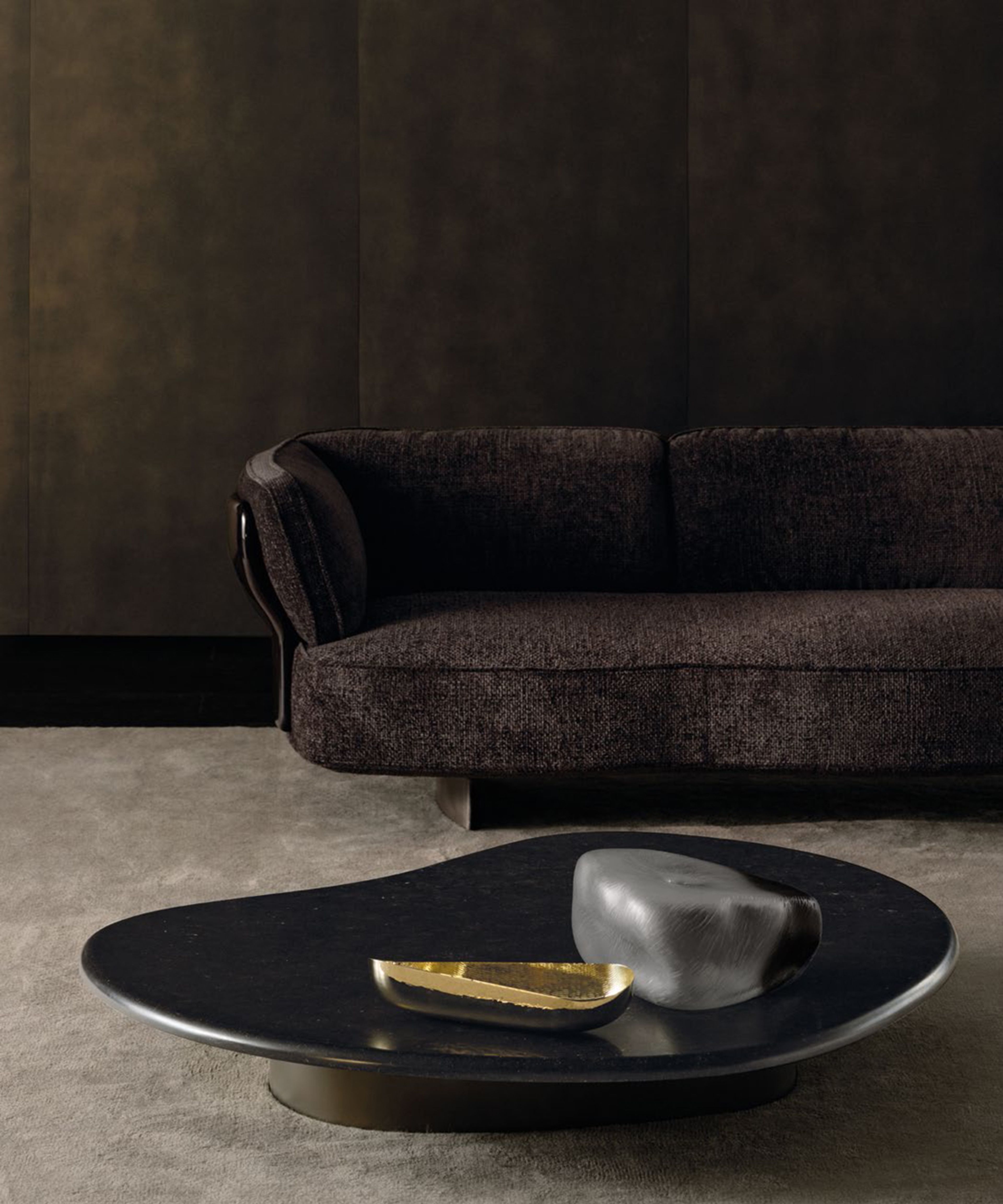 A blooming sofa by Minotti with sinuous support panels and organic forms.