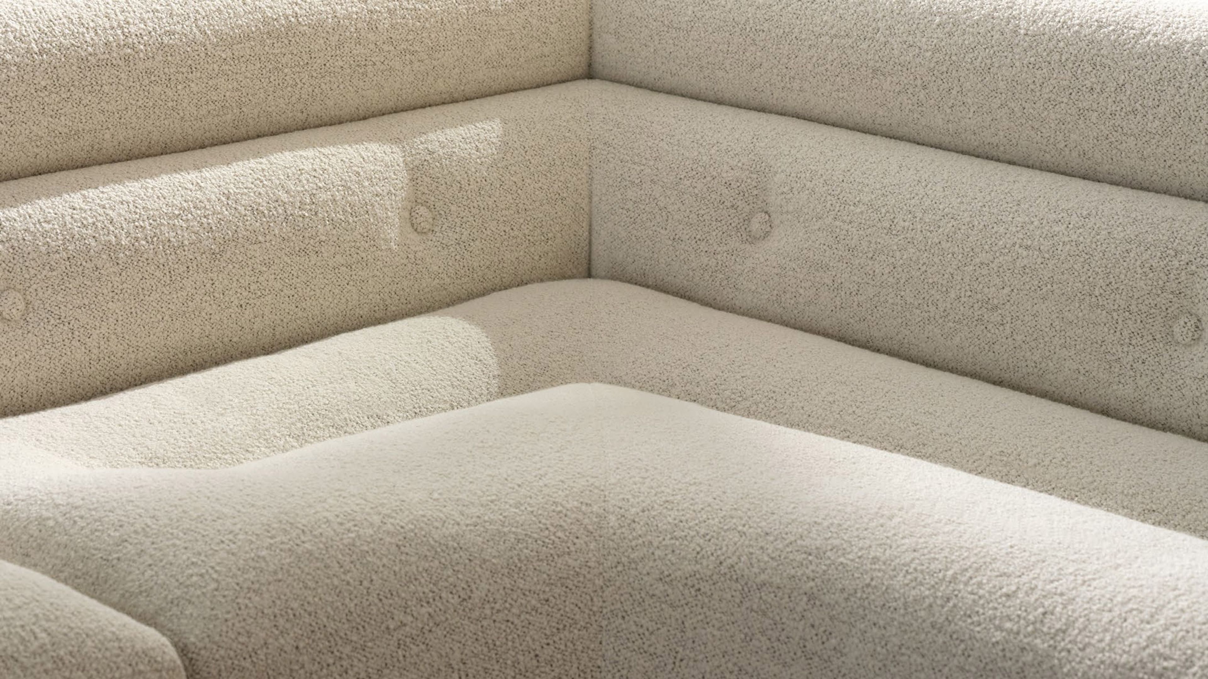 Un système d'assise aux volumes arrondis superposés, signé Minotti.
