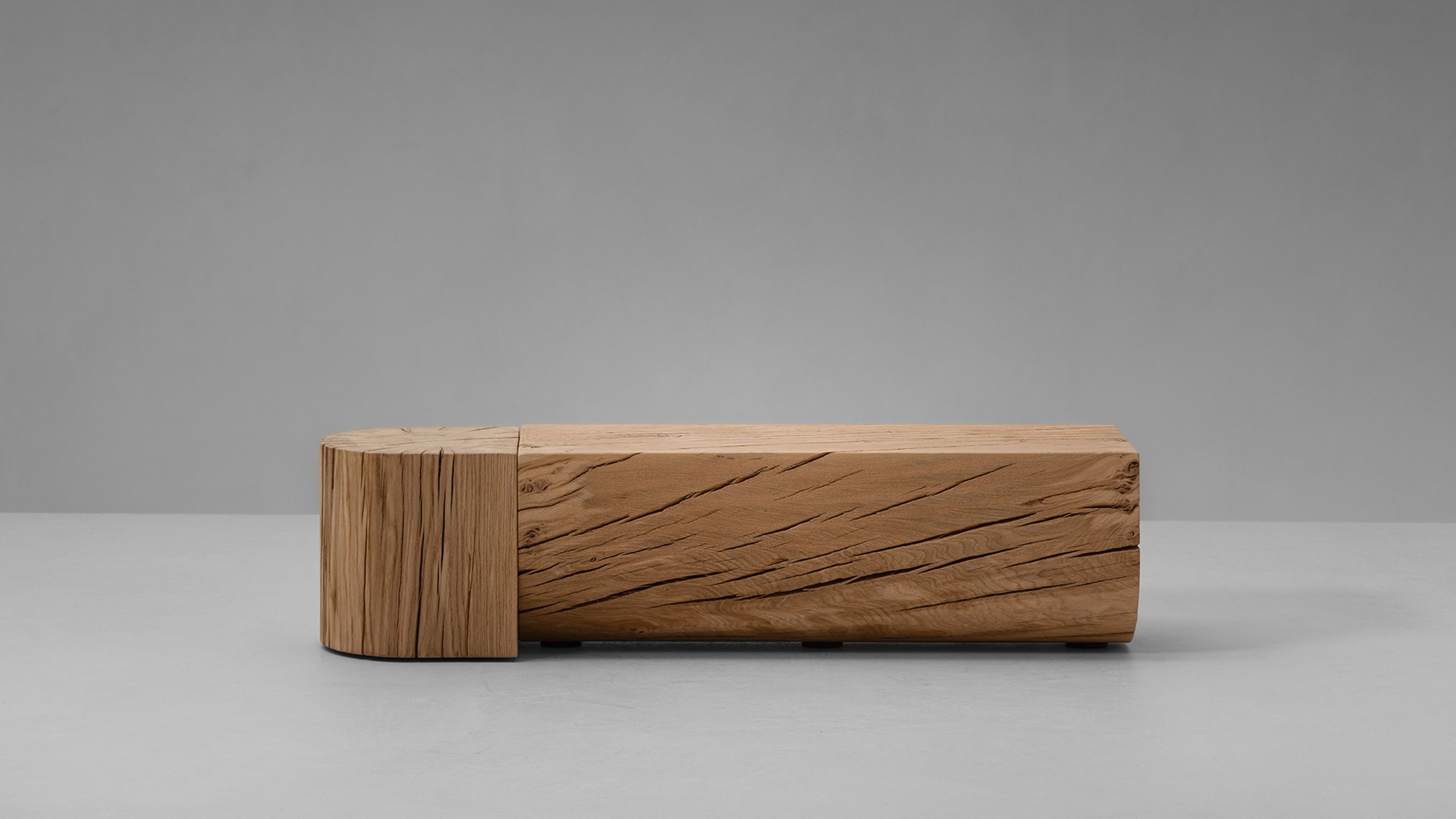 The Adjacencies Bench features a solid oak surface with a clear rectangular form.