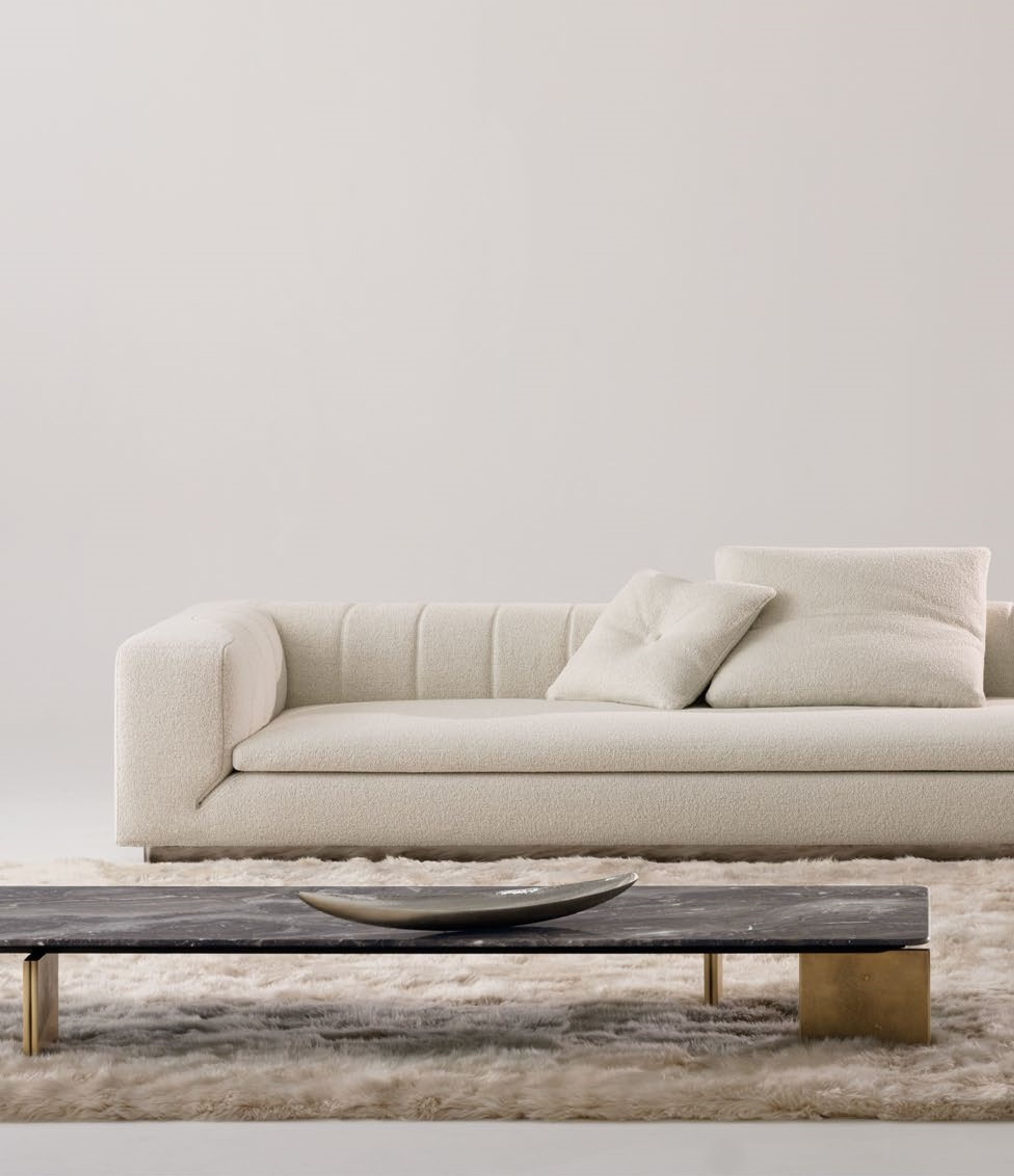 Table basse Minotti avec pieds sculptés à double courbure.