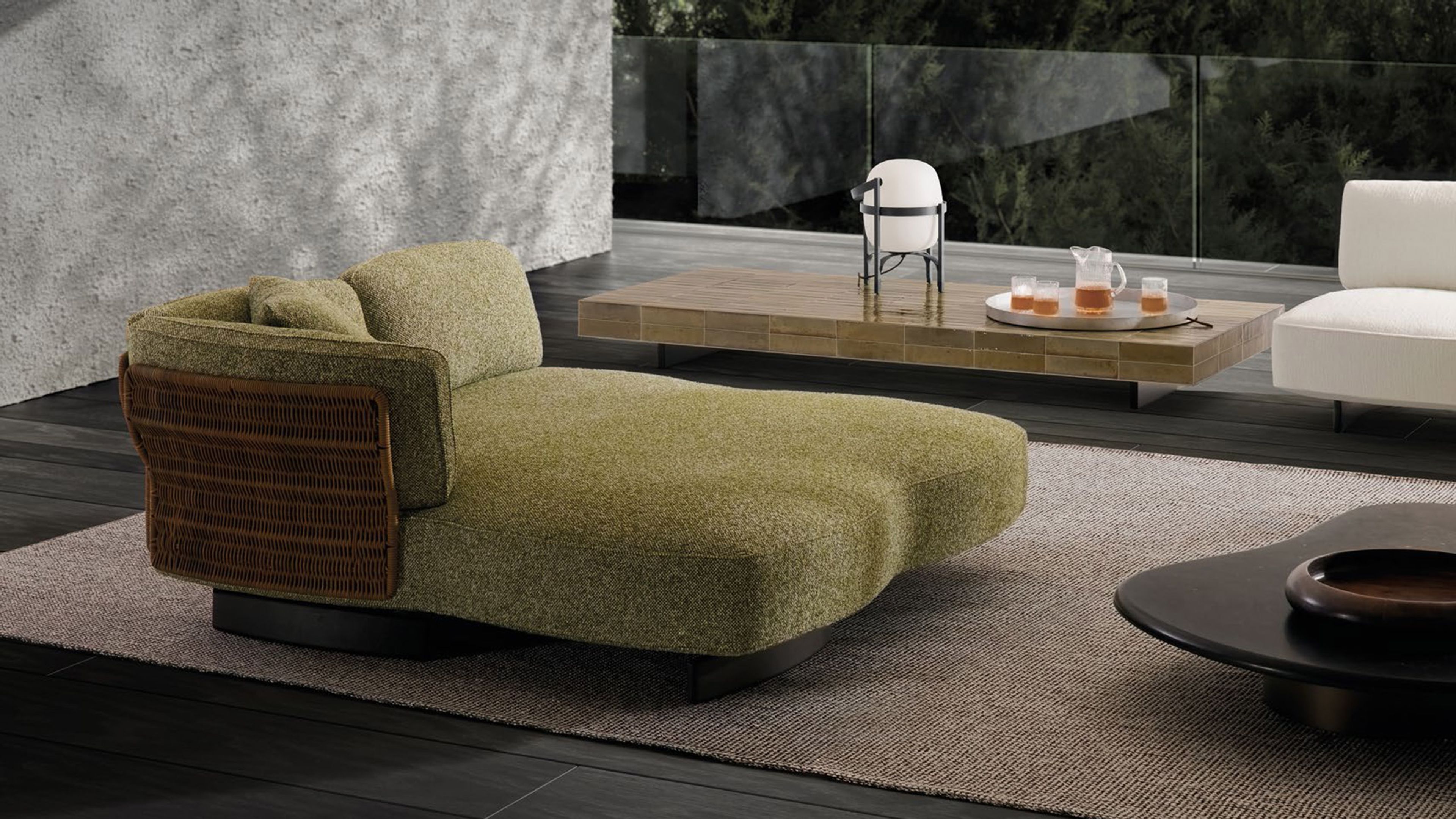 The Saki Cord Outdoor sofa combines sinuous panels with a woven cord structure.