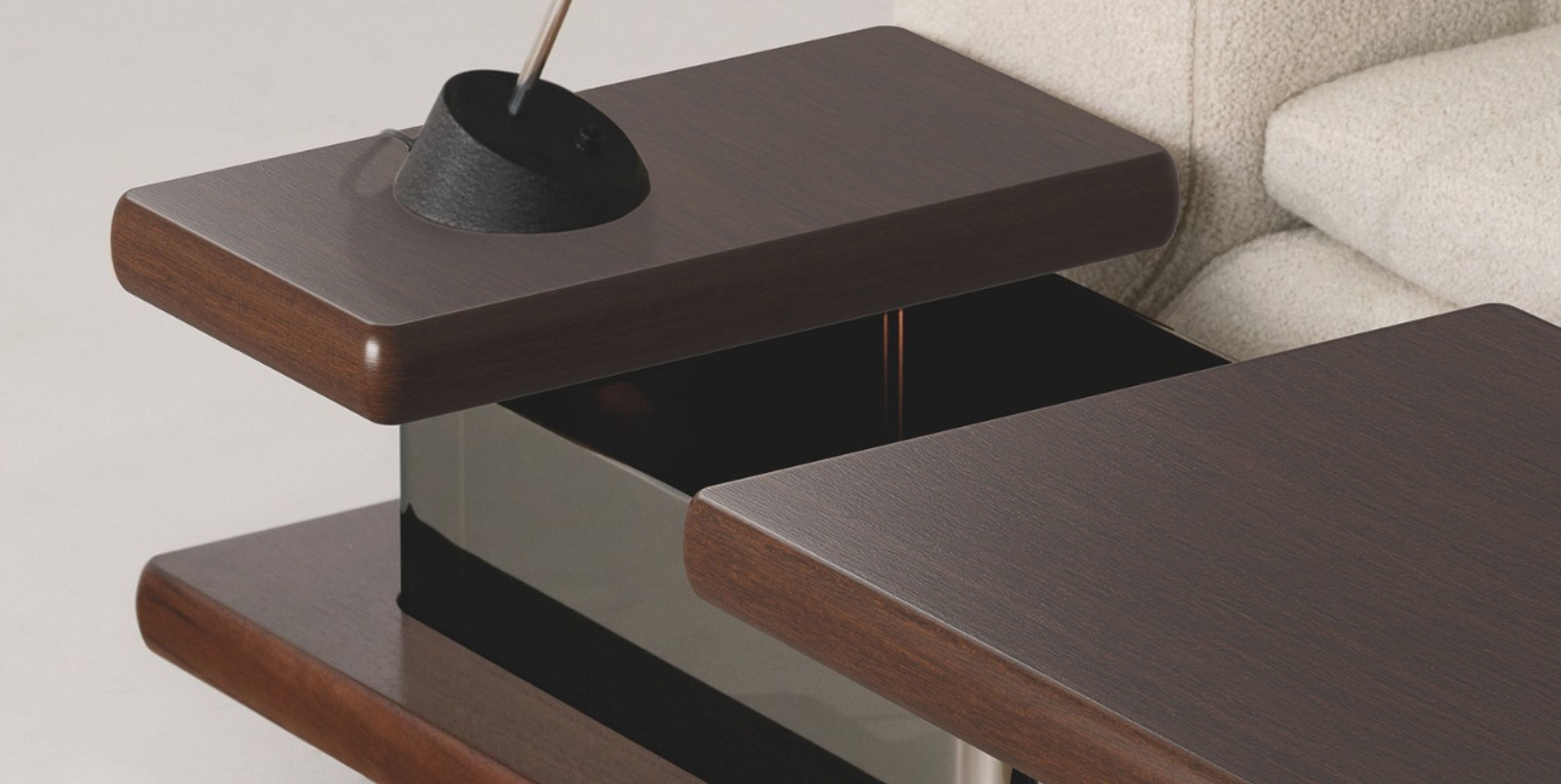Minotti Coffee table defined by sharp geometric volumes.