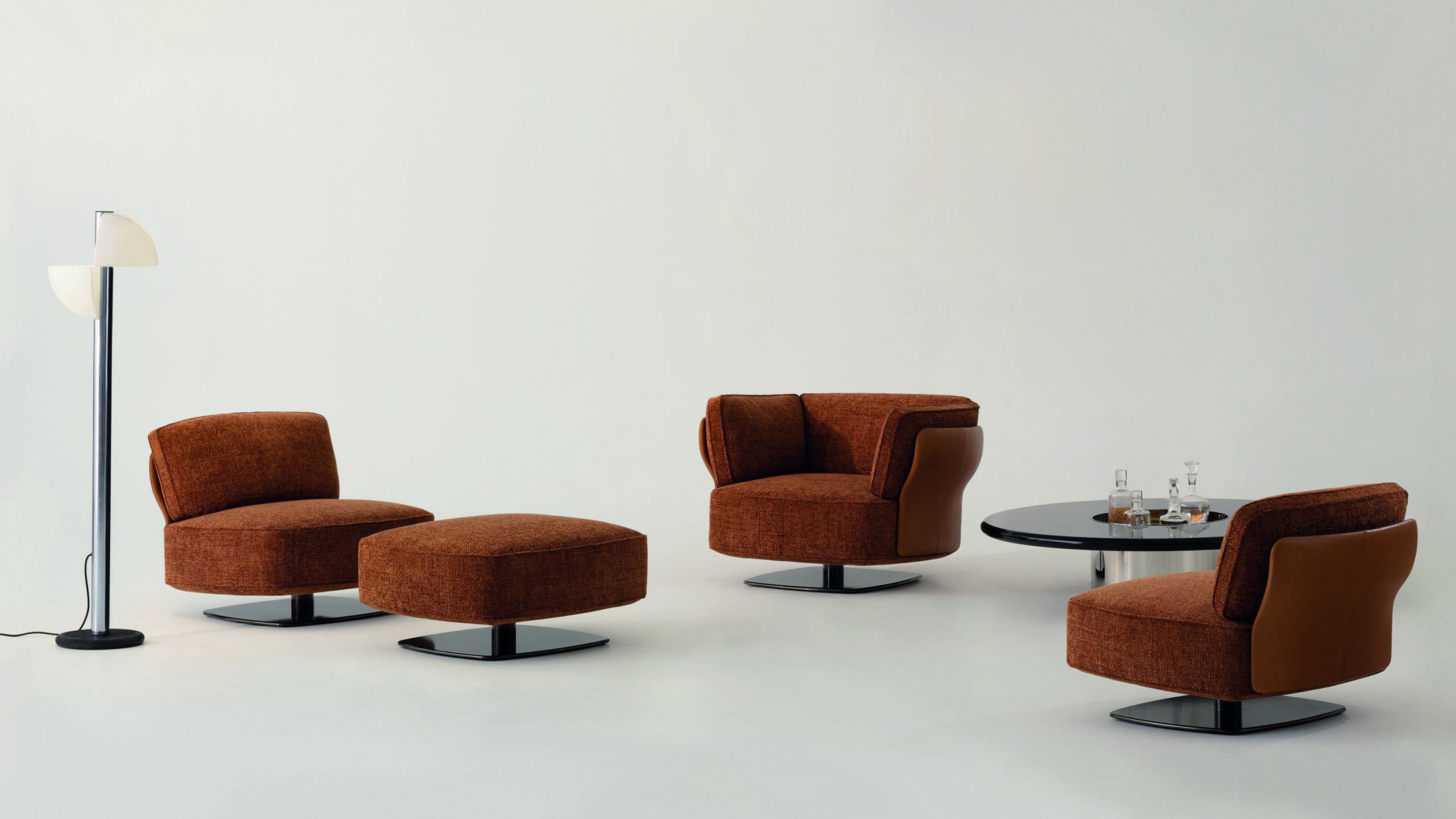 A sculptural armchair with enveloping organic forms by Minotti.
