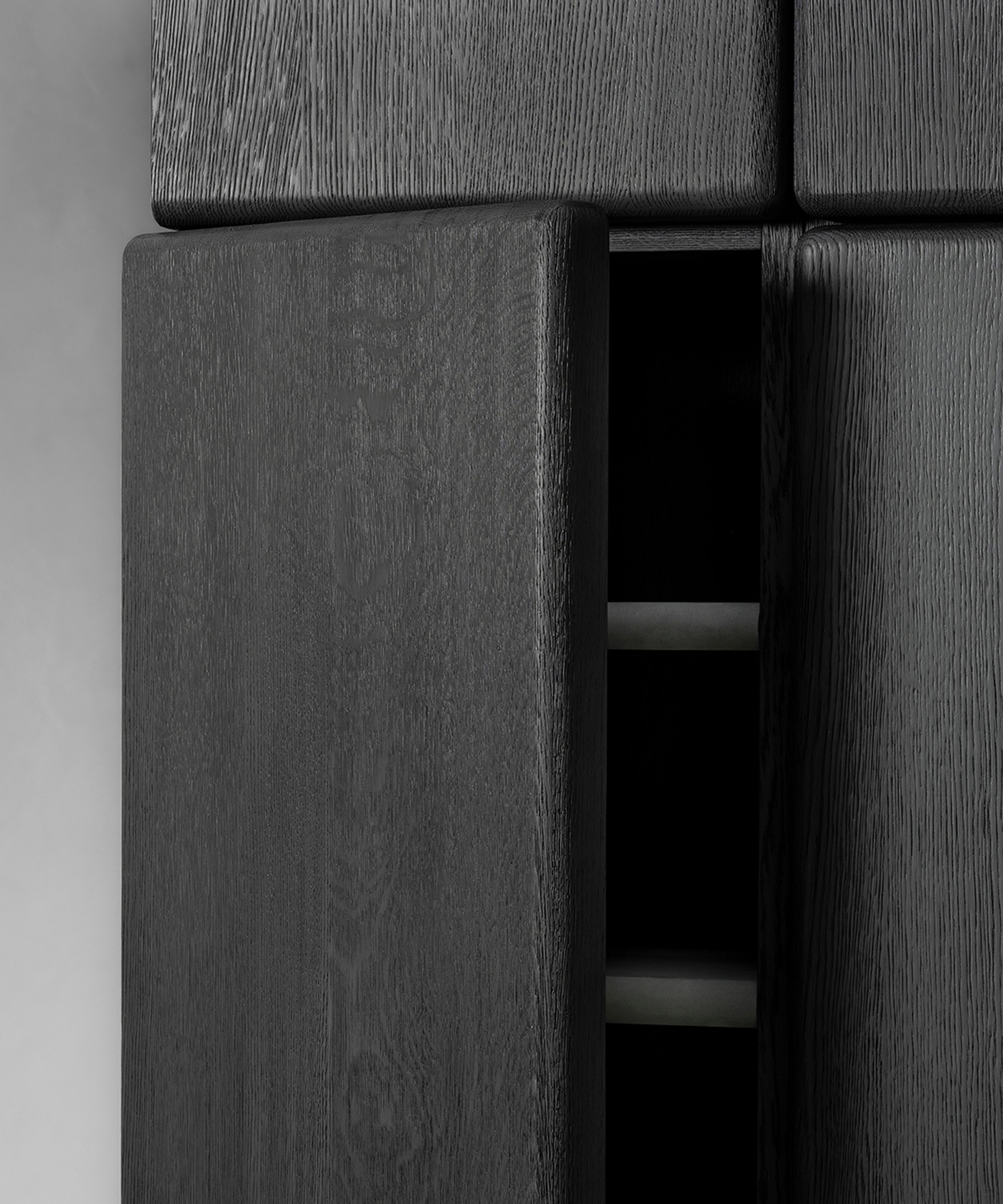 A wardrobe cabinet by Van Rossum divided into two asymmetrical parts.