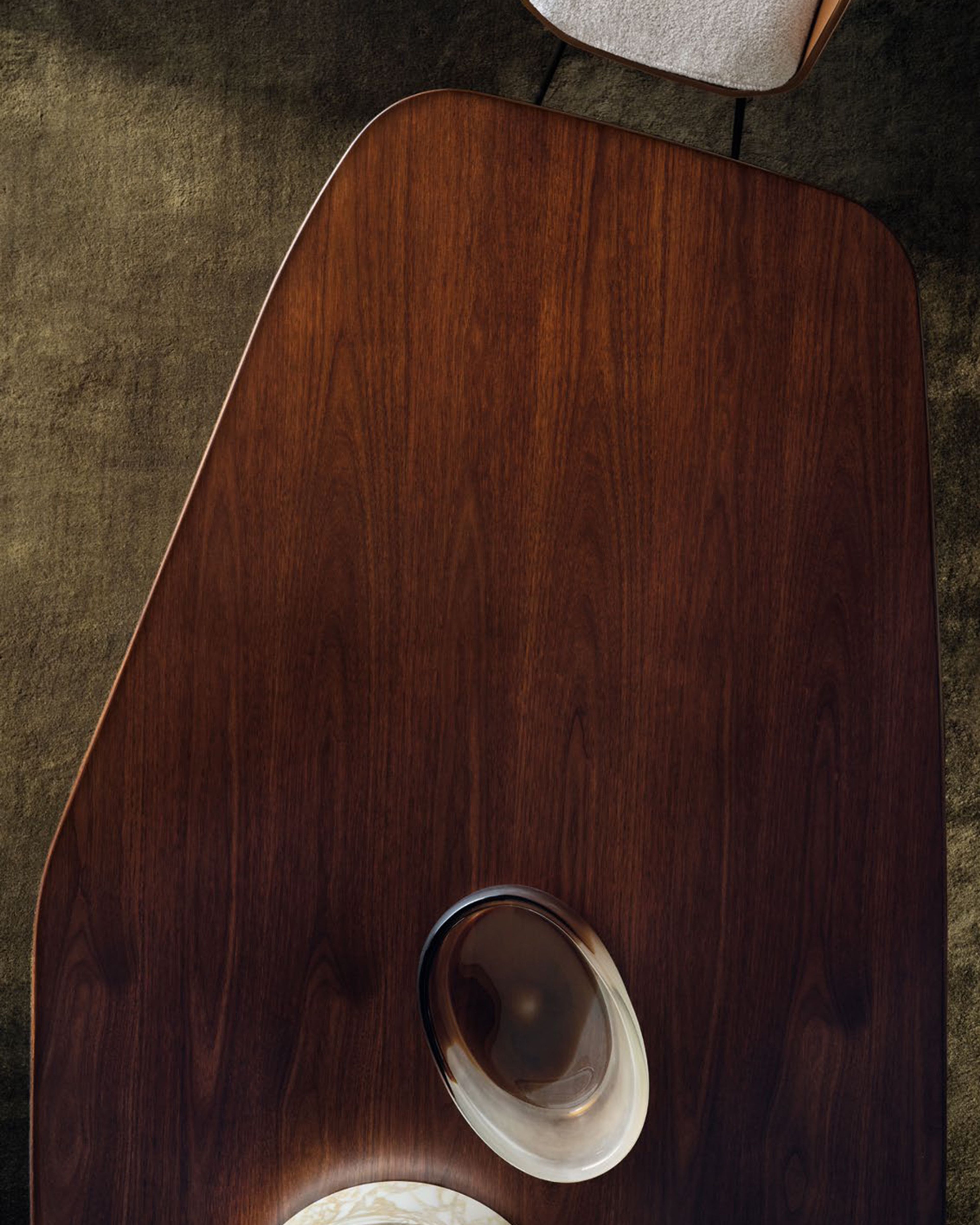 Dining table of a dynamic polygonal form by Minotti.