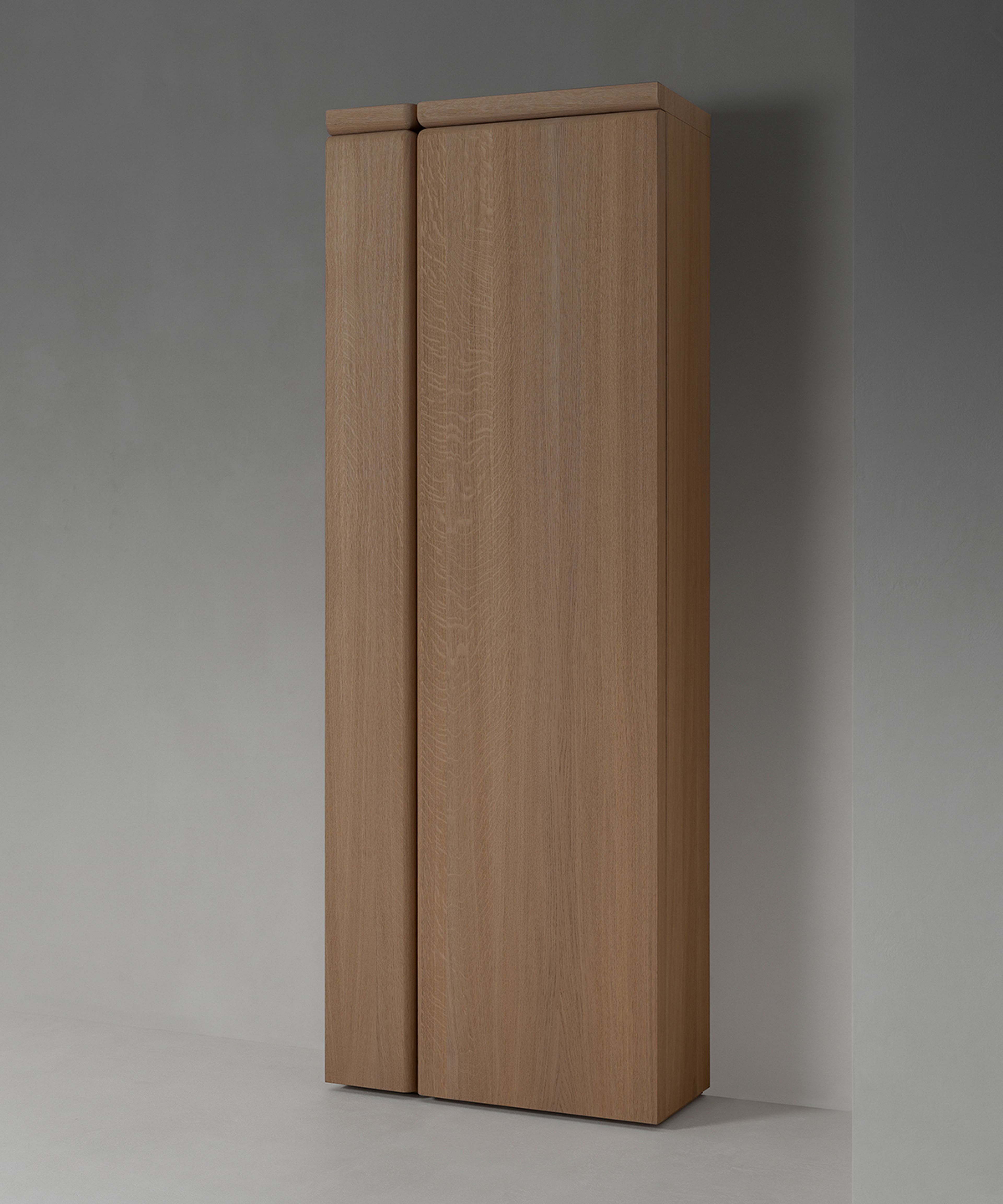 A tall, sleek storage cabinet by Van Rossum.