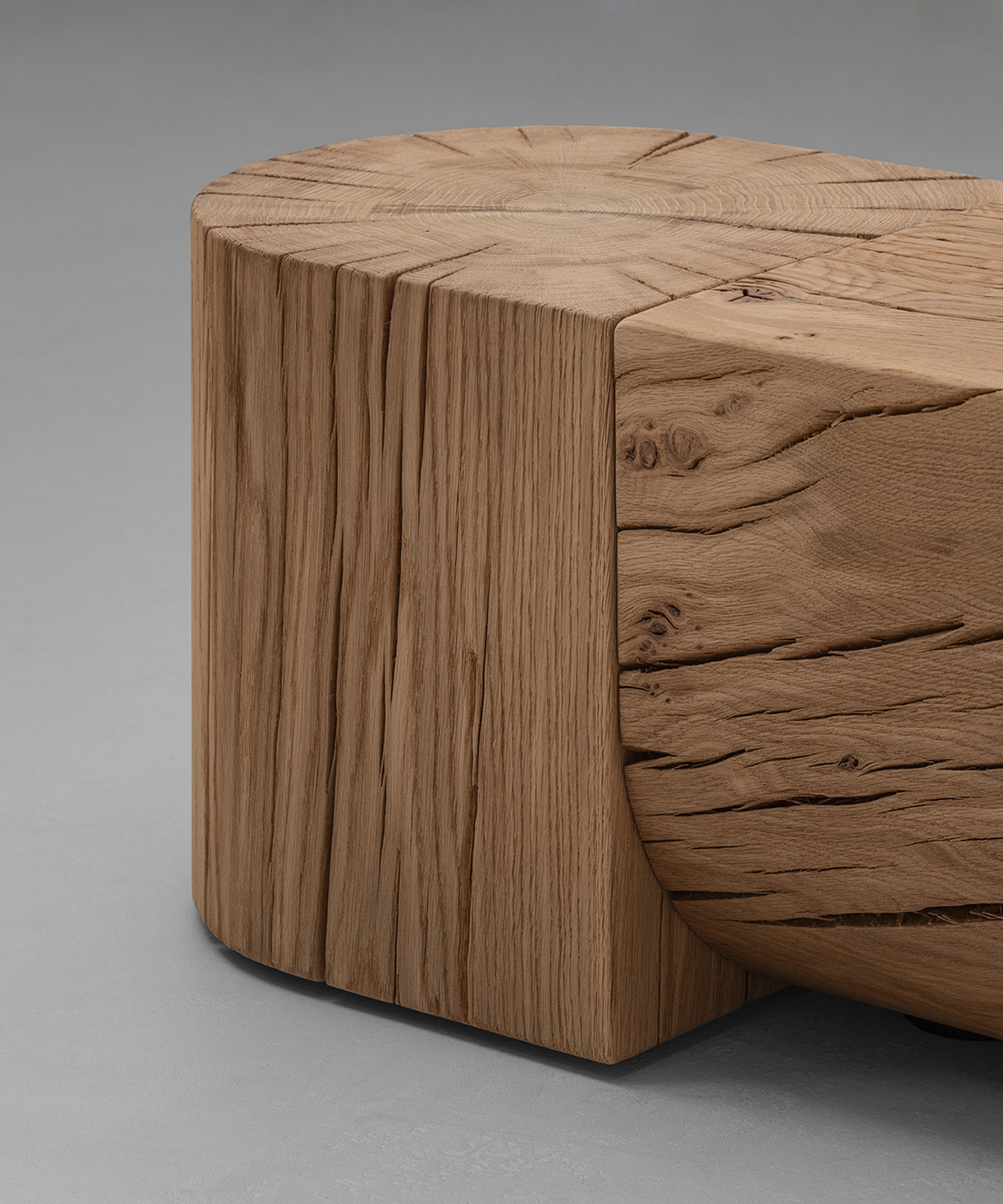 The Adjacencies Bench features a solid oak surface with a clear rectangular form.
