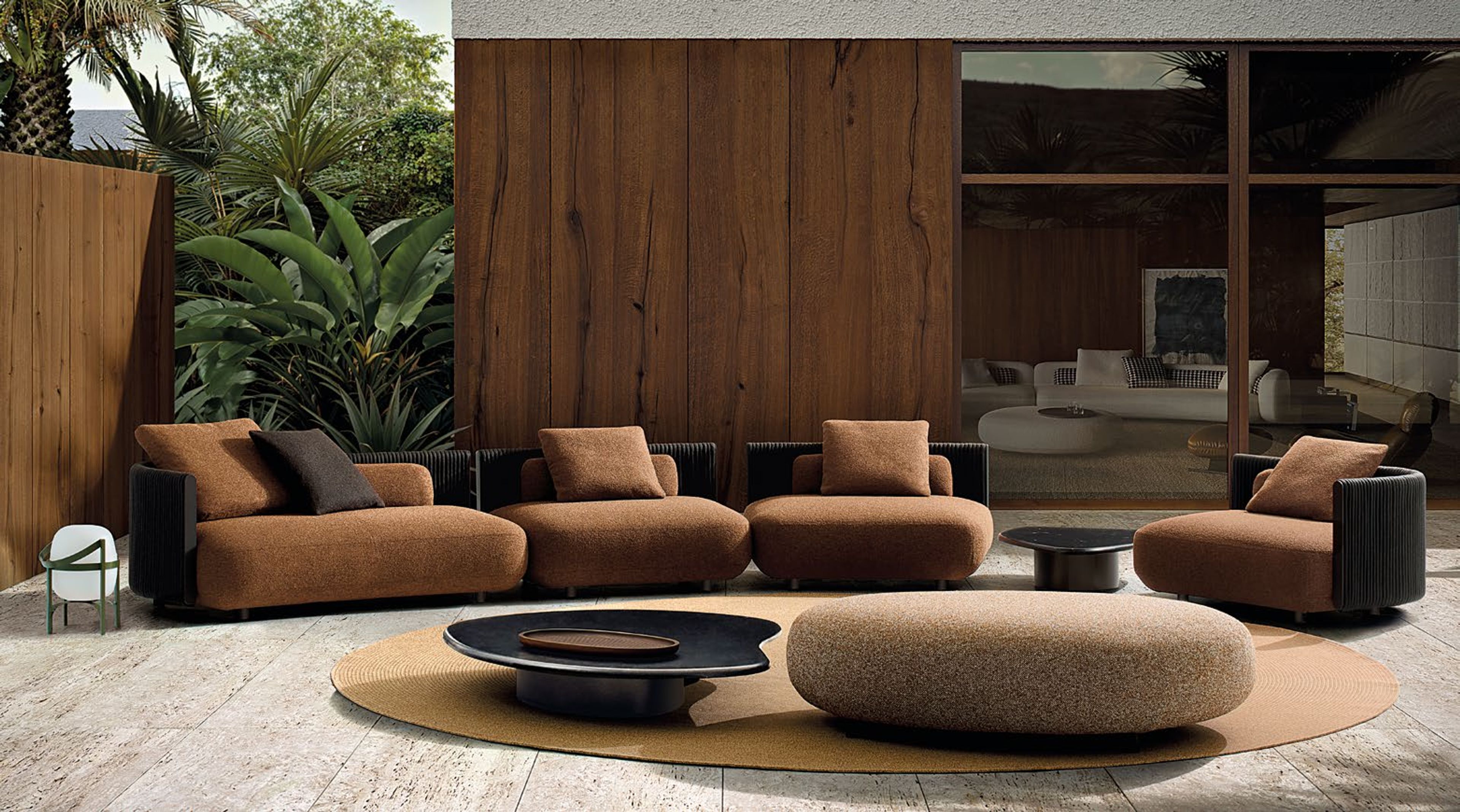 Minotti`s Bézier Outdoor table defined by a fluid, continuous form.