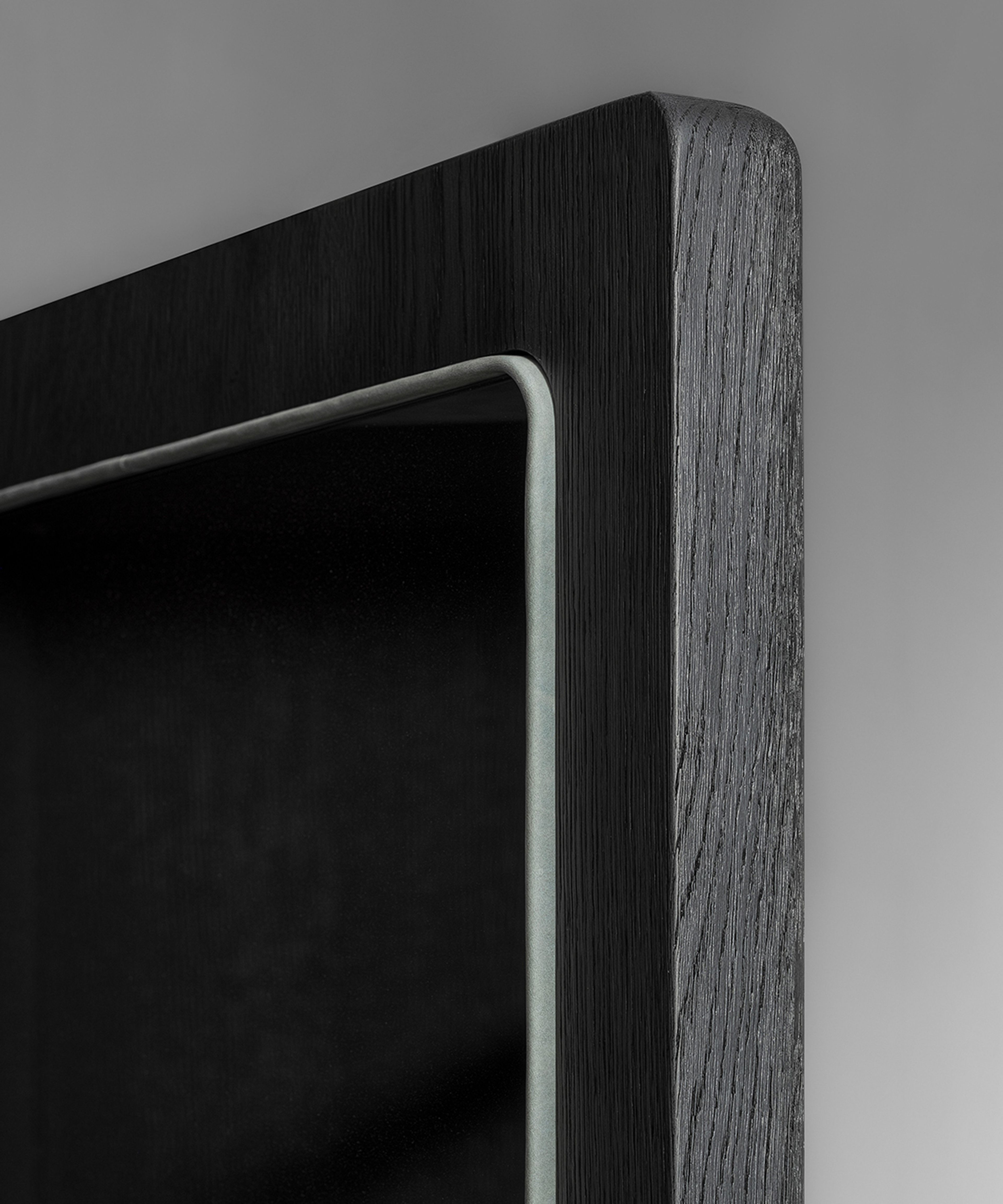 A wardrobe cabinet by Van Rossum divided into two asymmetrical parts.