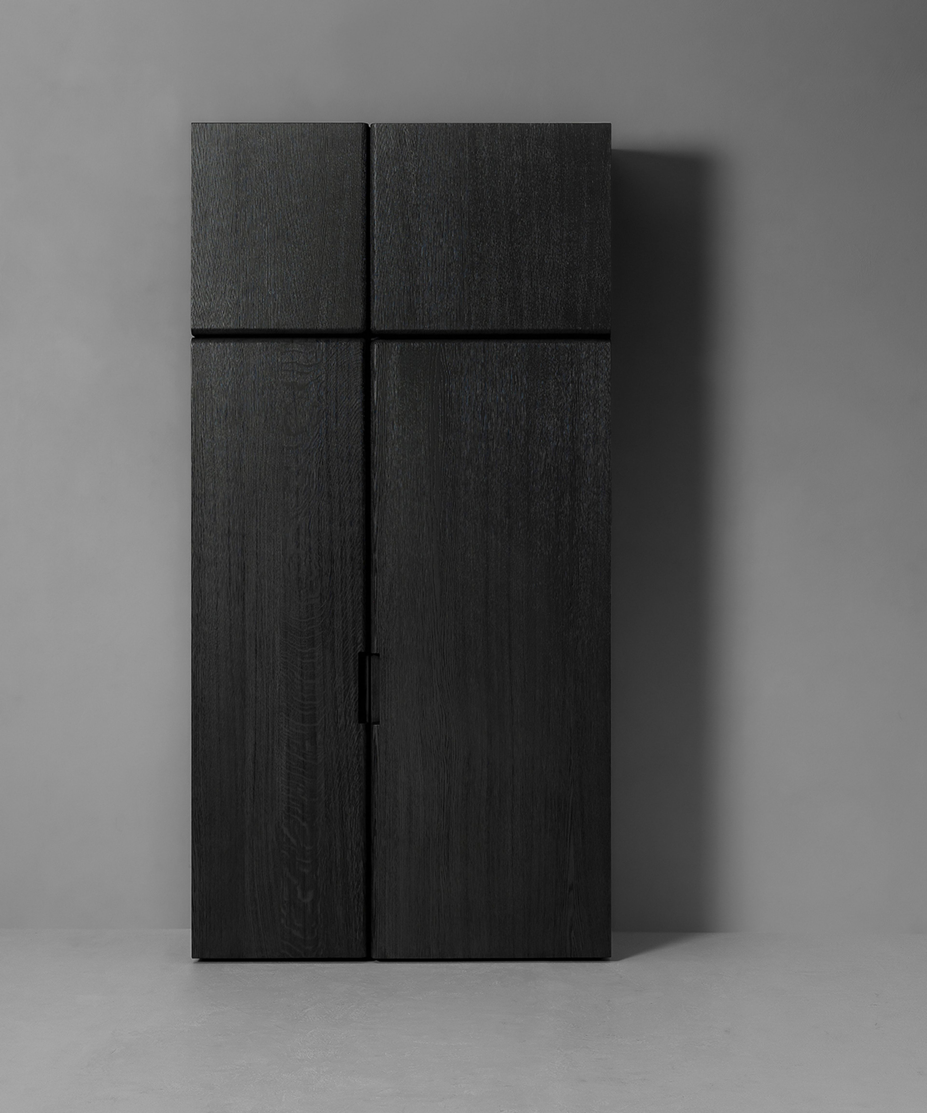 A wardrobe cabinet by Van Rossum divided into two asymmetrical parts.