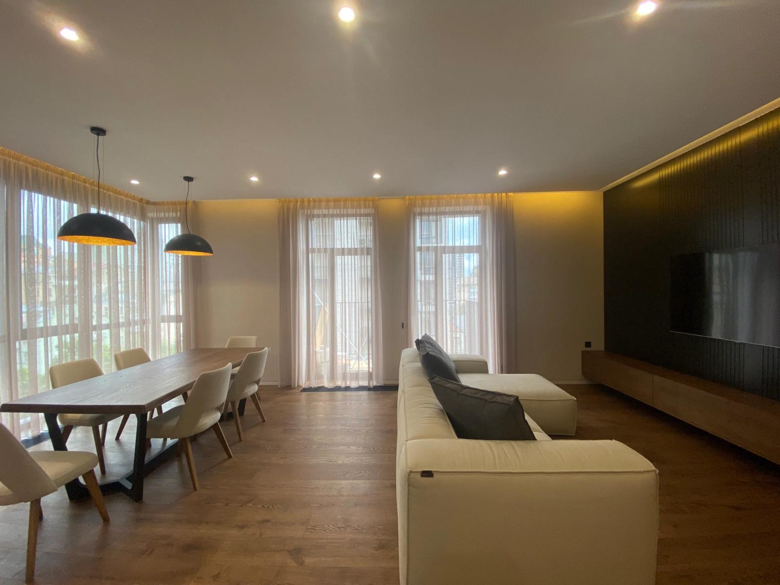 Spacious living and dining area with large windows and modern furniture, Bulvarno-Kudriavska 17A, Kyiv — Vestor.Estate