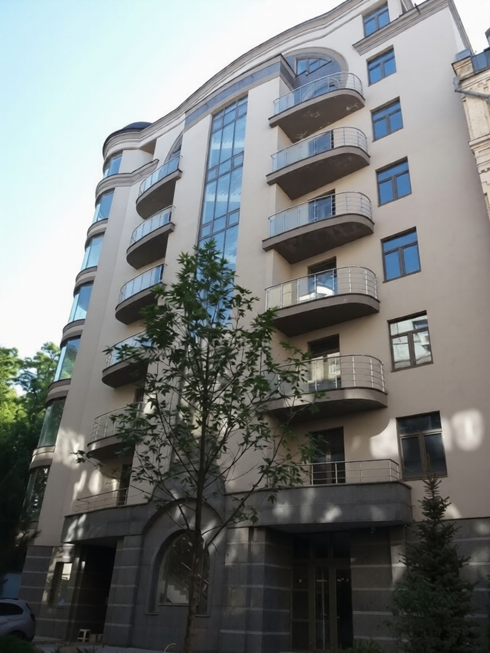 Modern building facade with curved balconies and large windows, Ivana Franka 11, Kyiv — Vestor.Estate