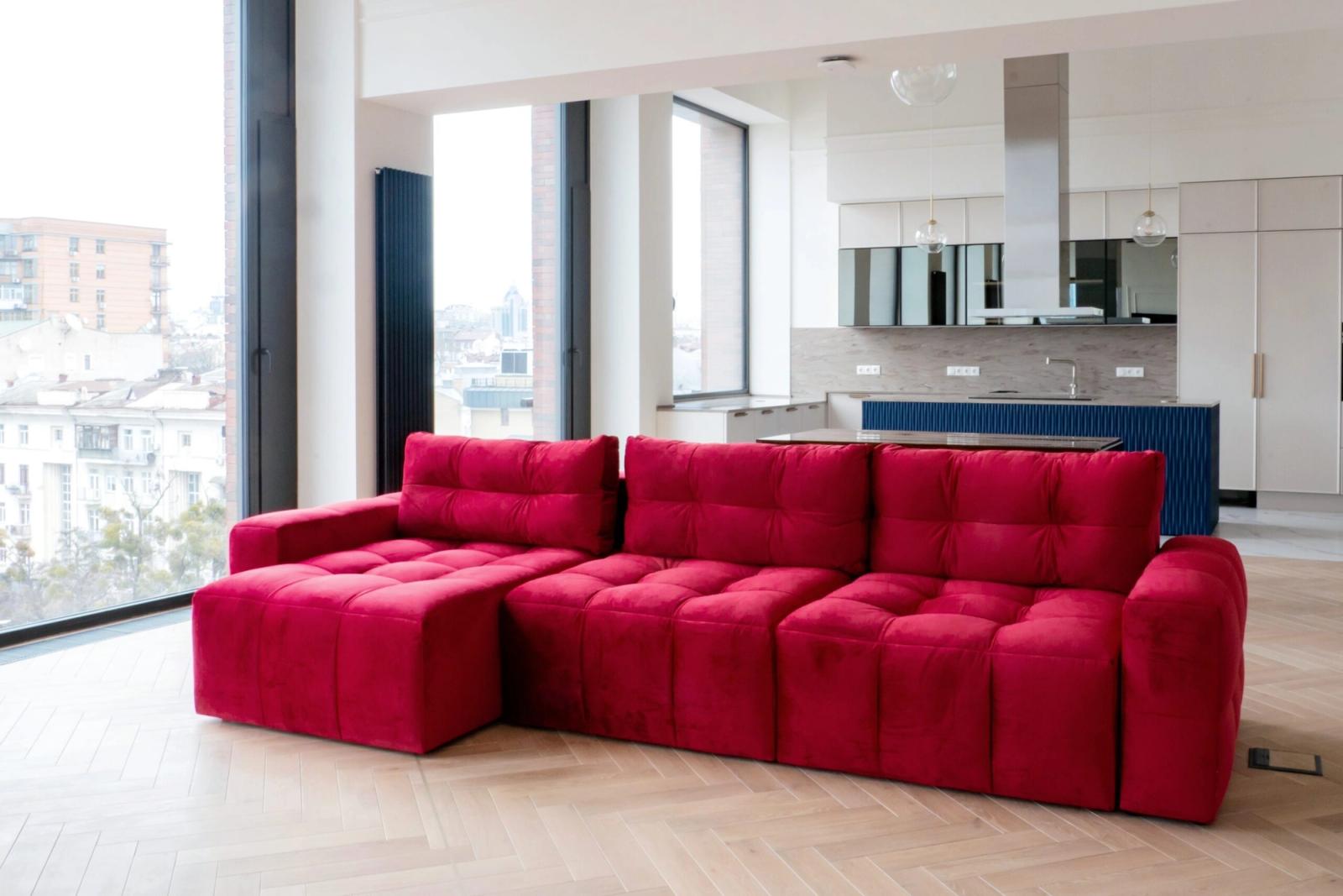 Living area with red sectional and large windows, Saksahanskoho, Kyiv — Vestor.Estate